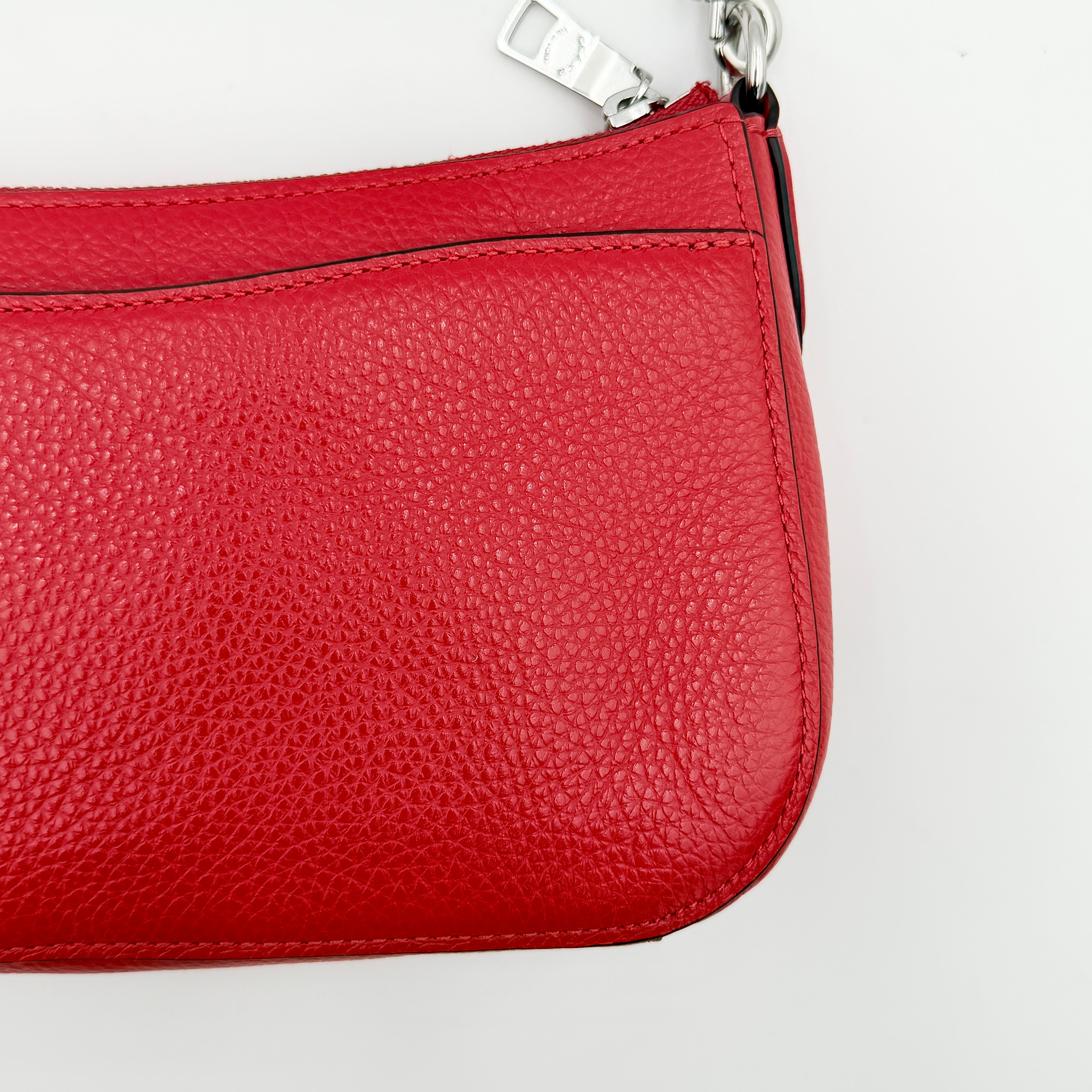 Coach 2Way Georgie Baguette in red pebbled leather with silver carriage logo hardware, shown with removable shoulder strap.
