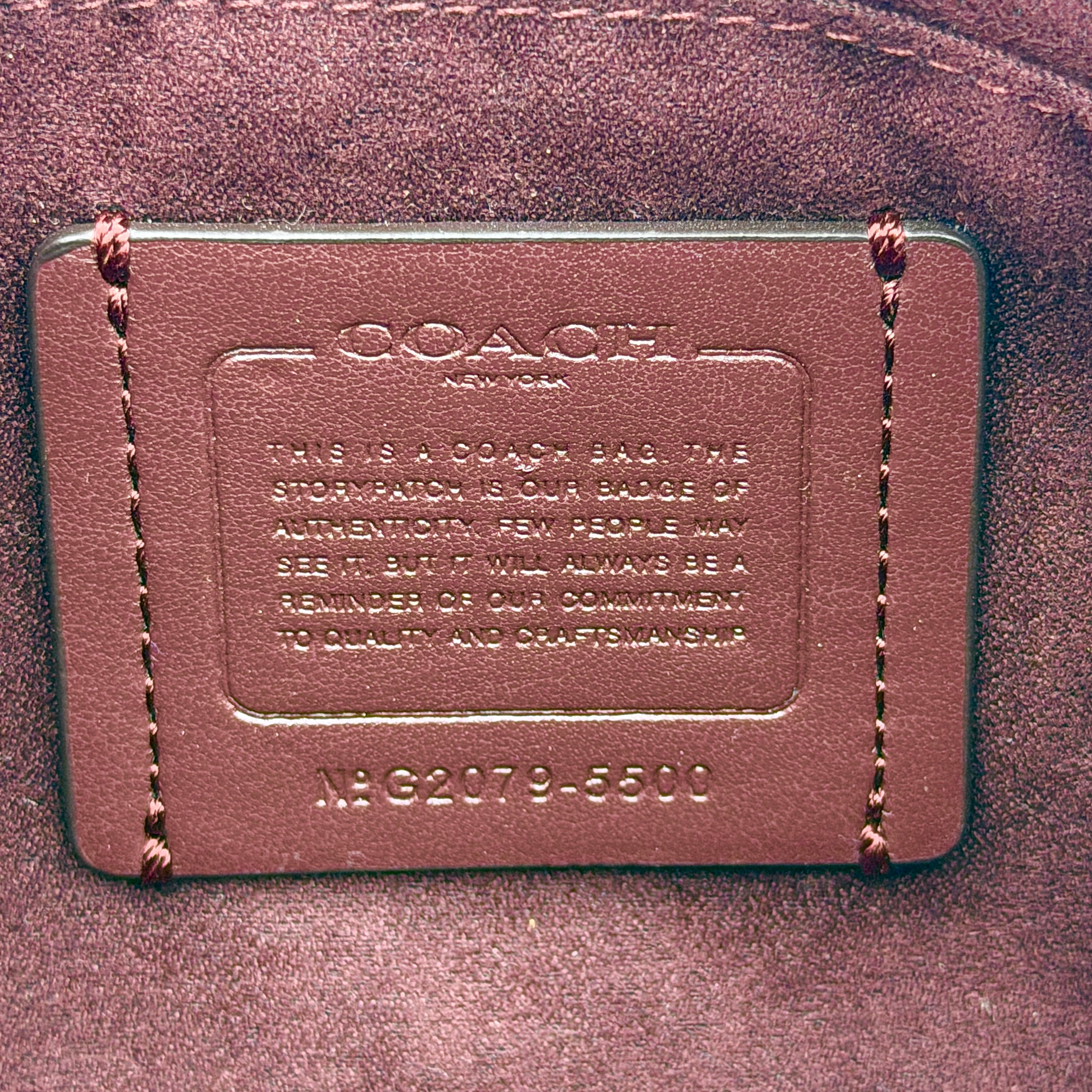 Coach 2Way Georgie Baguette in red pebbled leather with silver carriage logo hardware, shown with removable shoulder strap.