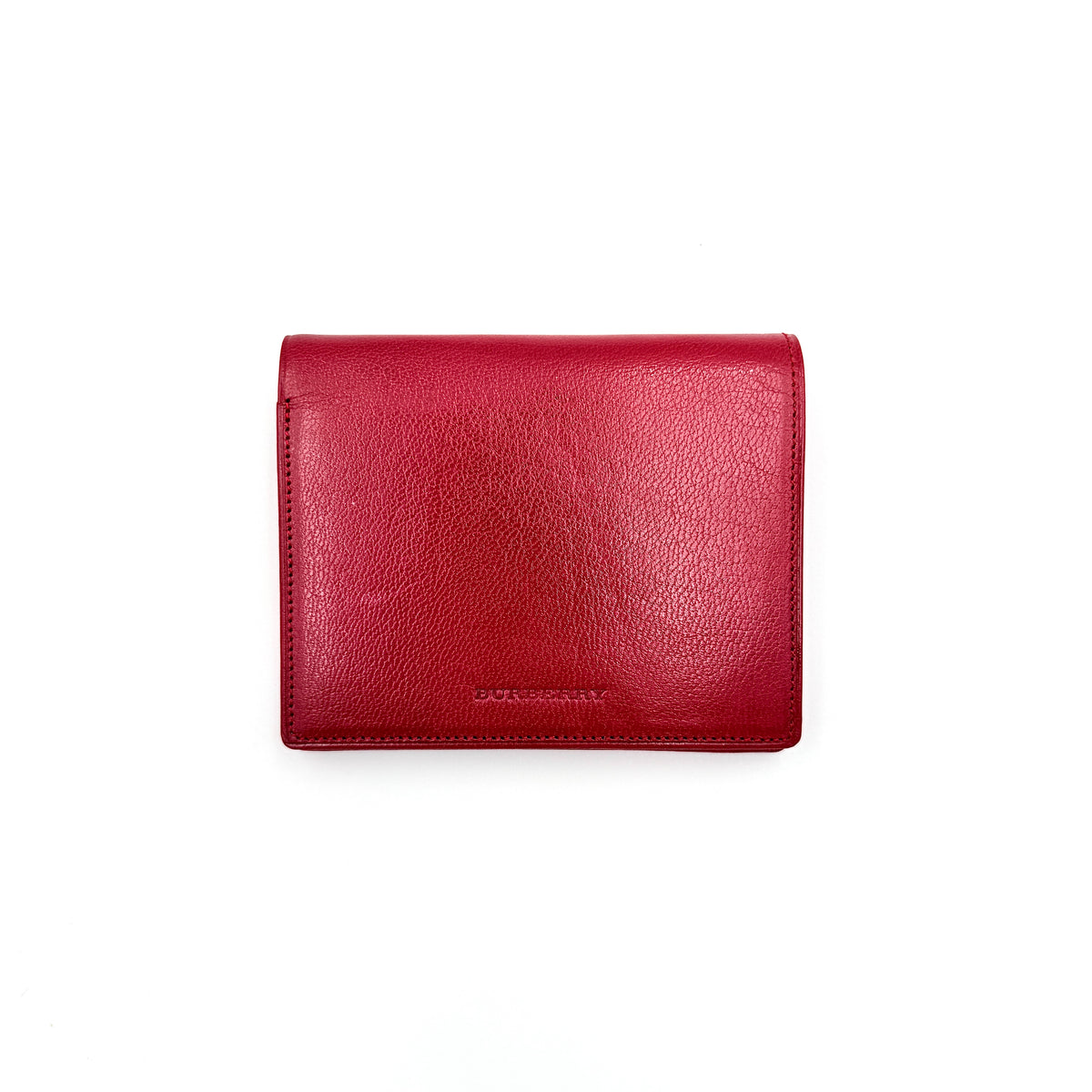 Burberry Nova Check bifold wallet in grained red leather with signature tartan interior, shown closed against a white background