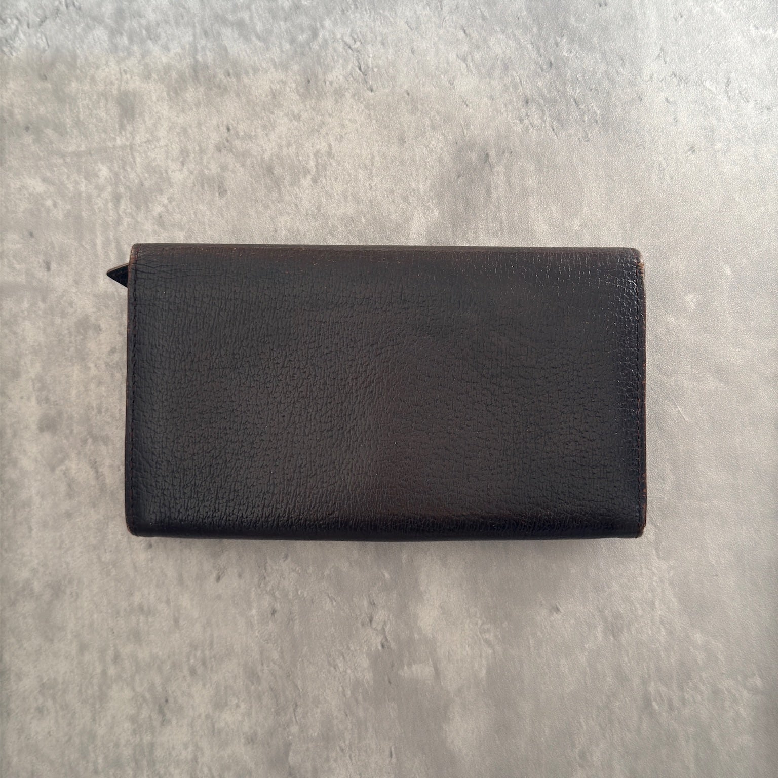 Vivienne Westwood Signature Orb Bi-fold Long Wallet in Black Leather with Gold-Tone Hardware and Multiple Interior Compartments.