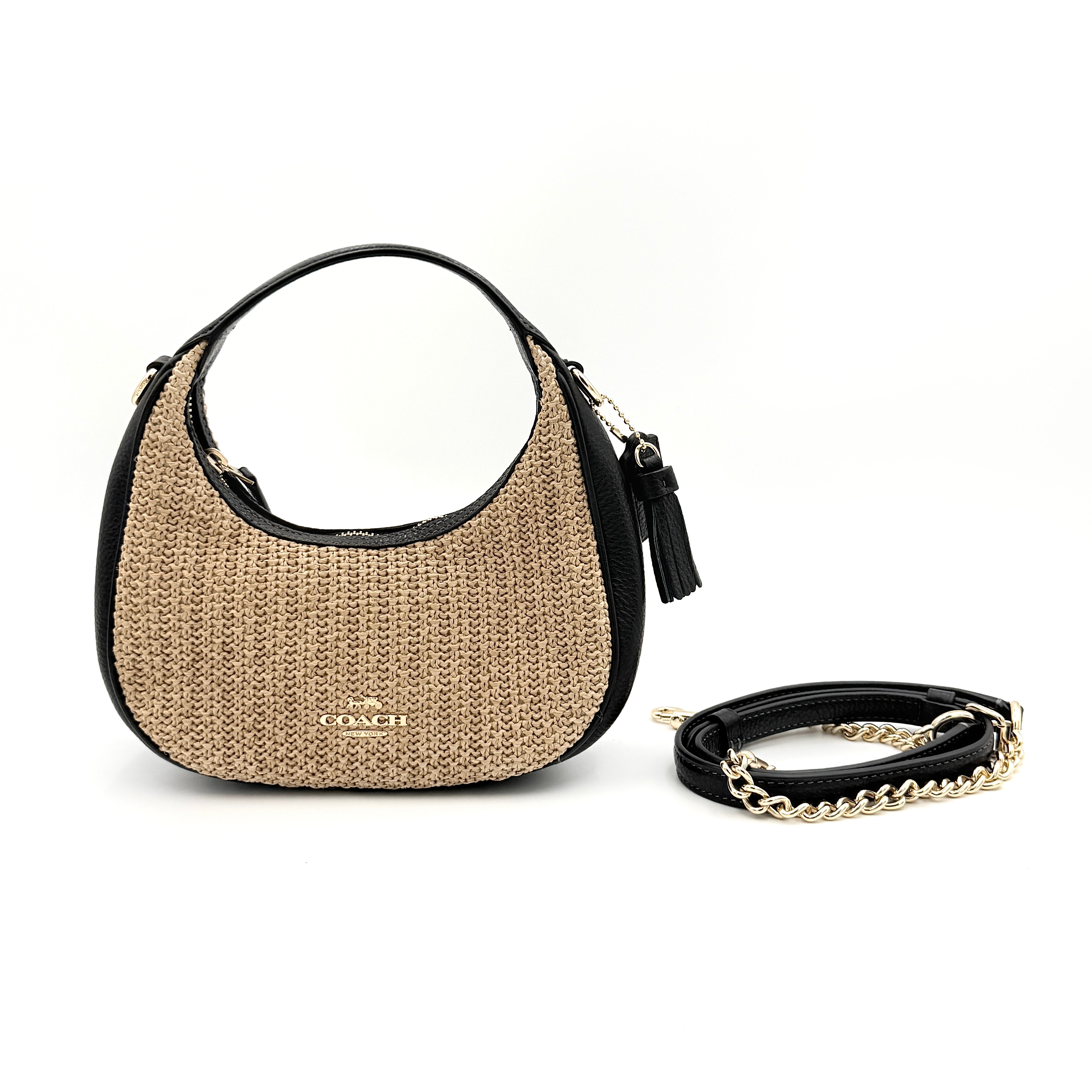Coach Carmen Mini 2Way Shoulder Bag in beige and black with textured woven body, leather trim, and gold-tone hardware.