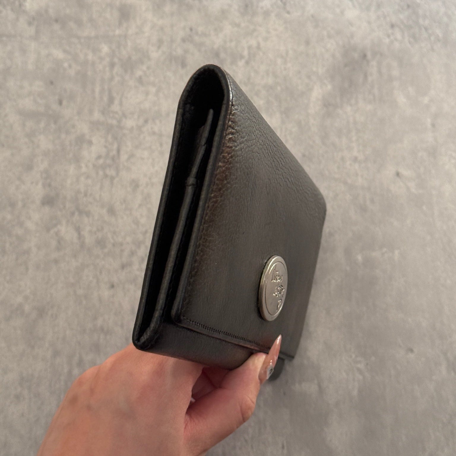 Vivienne Westwood Icon Signature Long Wallet in black leather, featuring logo plaque, multiple card slots and zip compartment interior, snap button closure, vintage condition.