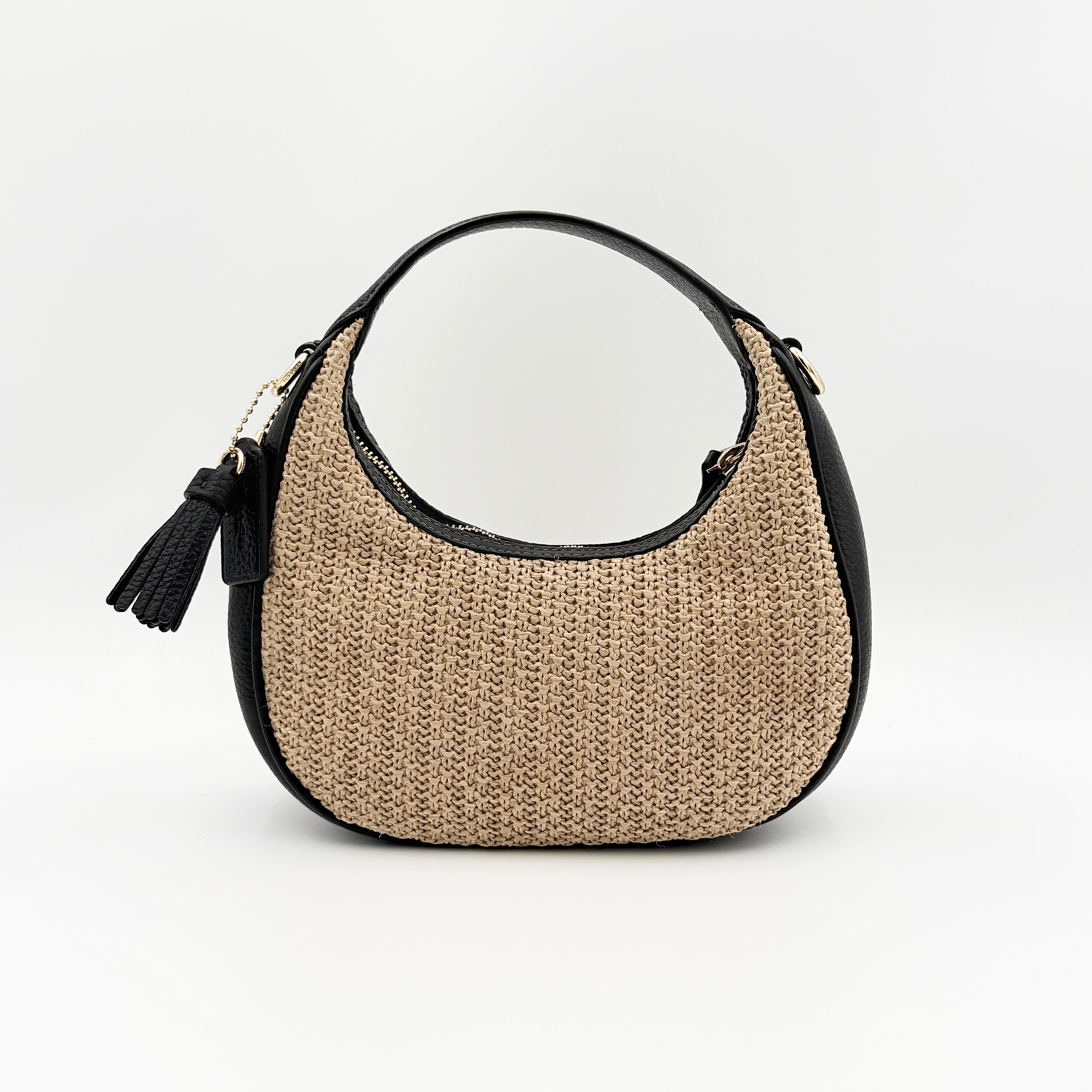 Coach Carmen Mini 2Way Shoulder Bag in beige and black with textured woven body, leather trim, and gold-tone hardware.