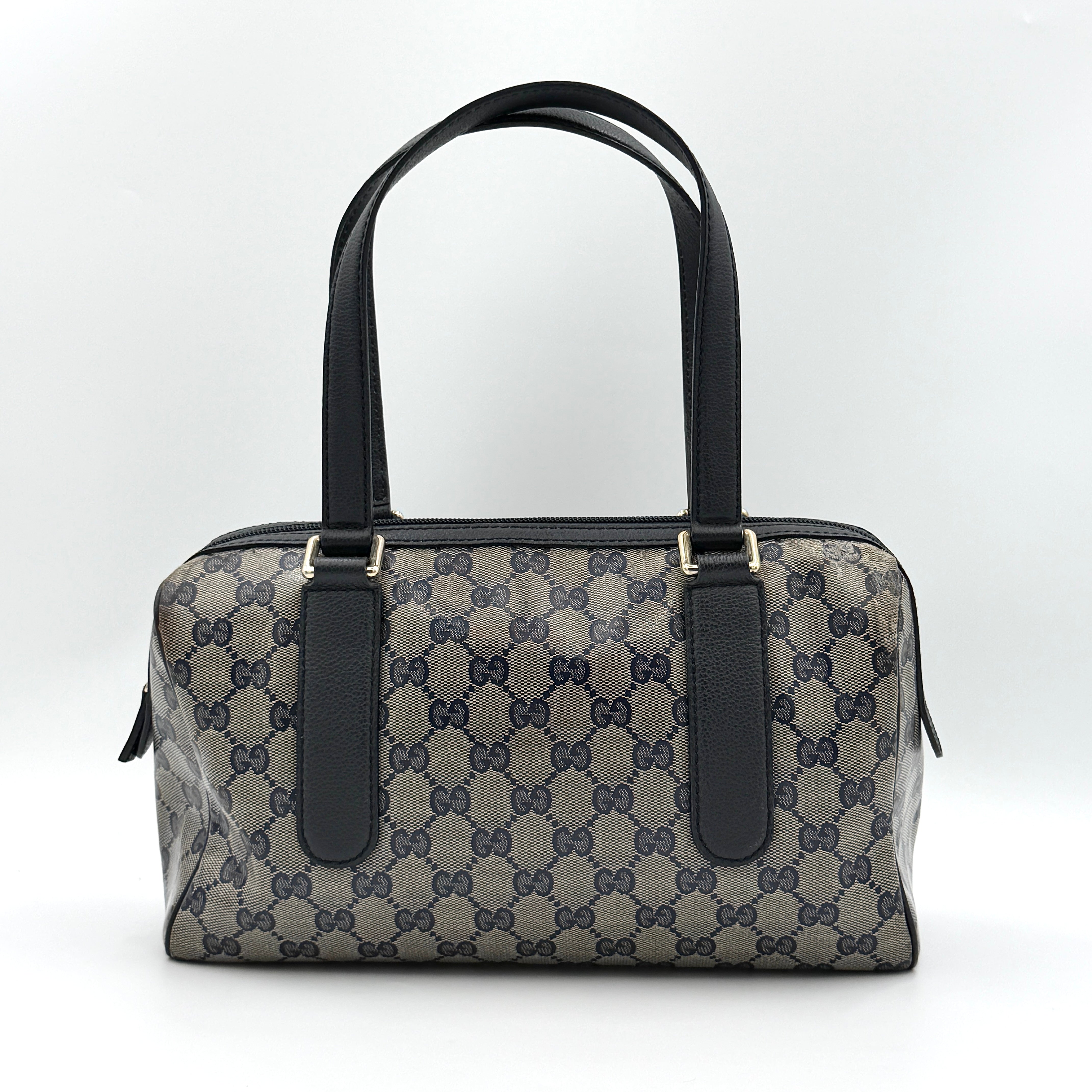 Front-facing view of the Gucci GG Monogram Crystal Boston Bag in grey and black with dual top handles and signature GG canvas.
