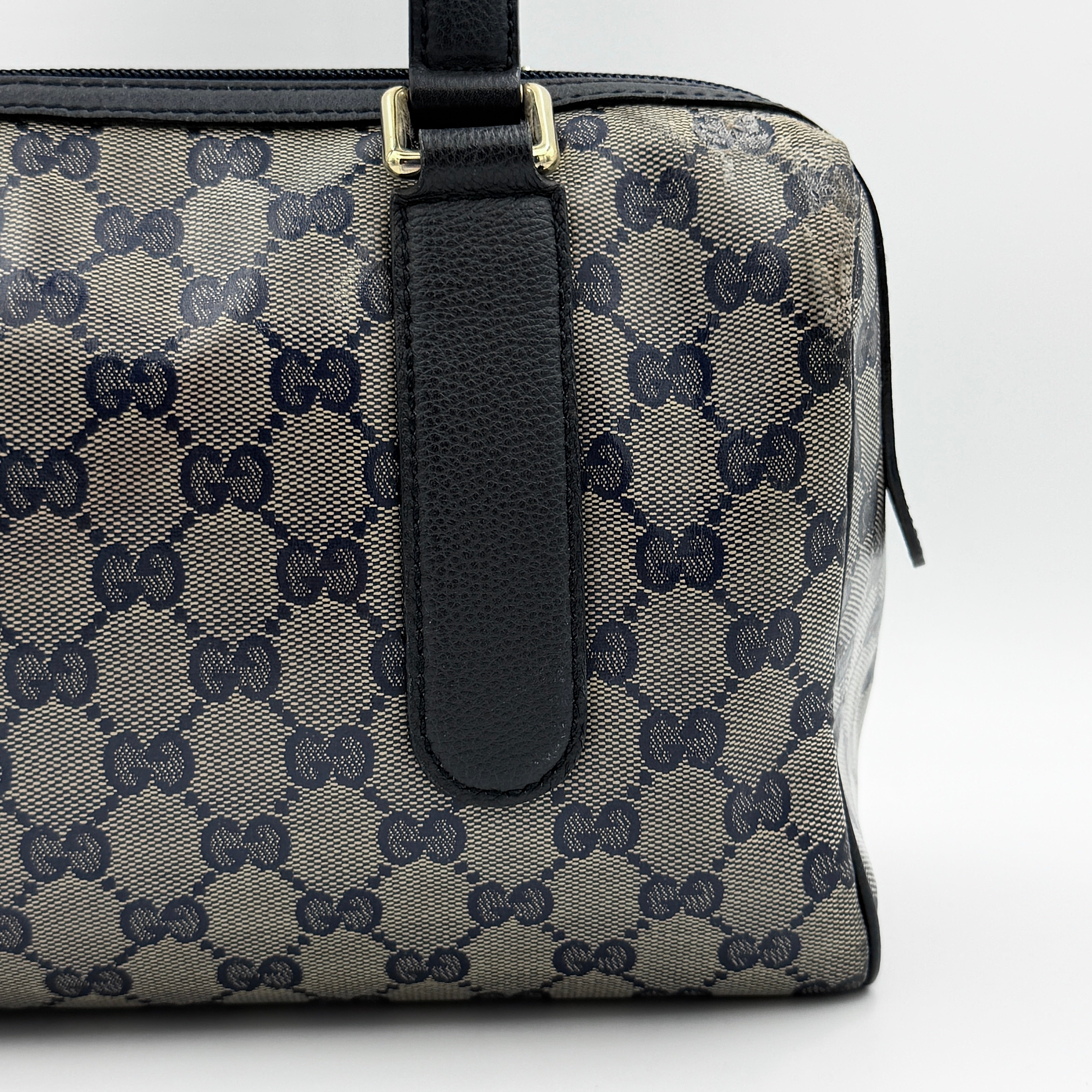 Front-facing view of the Gucci GG Monogram Crystal Boston Bag in grey and black with dual top handles and signature GG canvas.