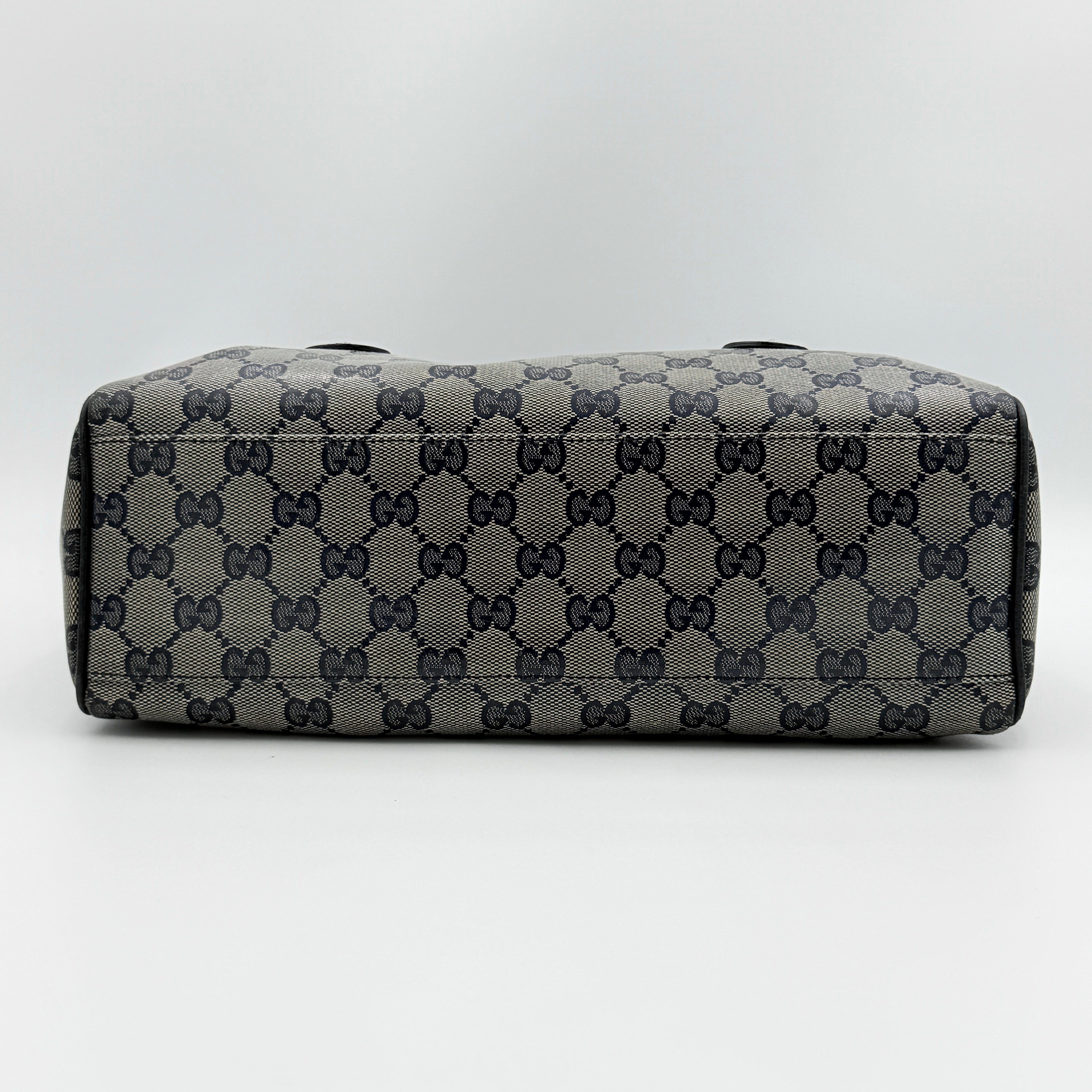 Front-facing view of the Gucci GG Monogram Crystal Boston Bag in grey and black with dual top handles and signature GG canvas.
