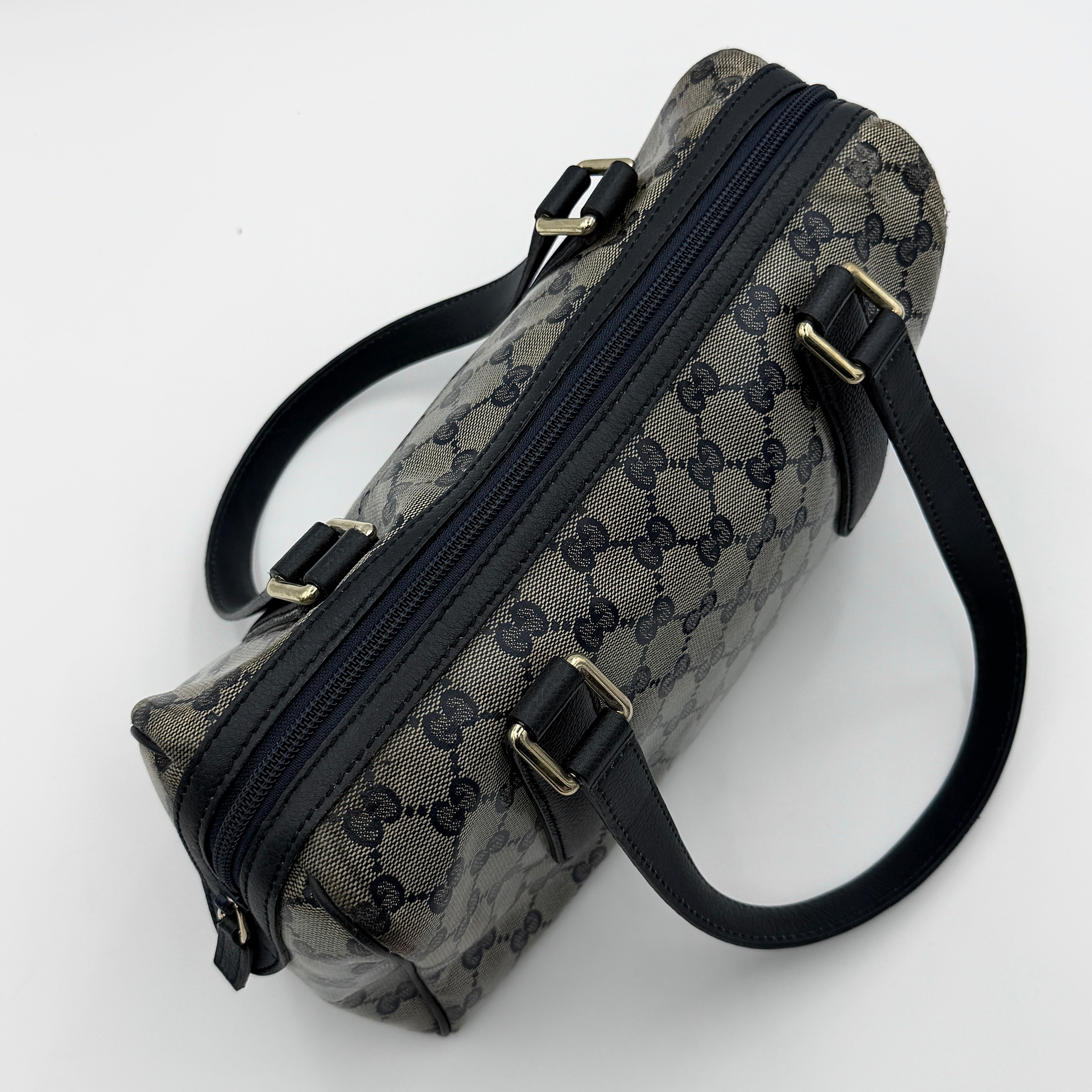 Front-facing view of the Gucci GG Monogram Crystal Boston Bag in grey and black with dual top handles and signature GG canvas.