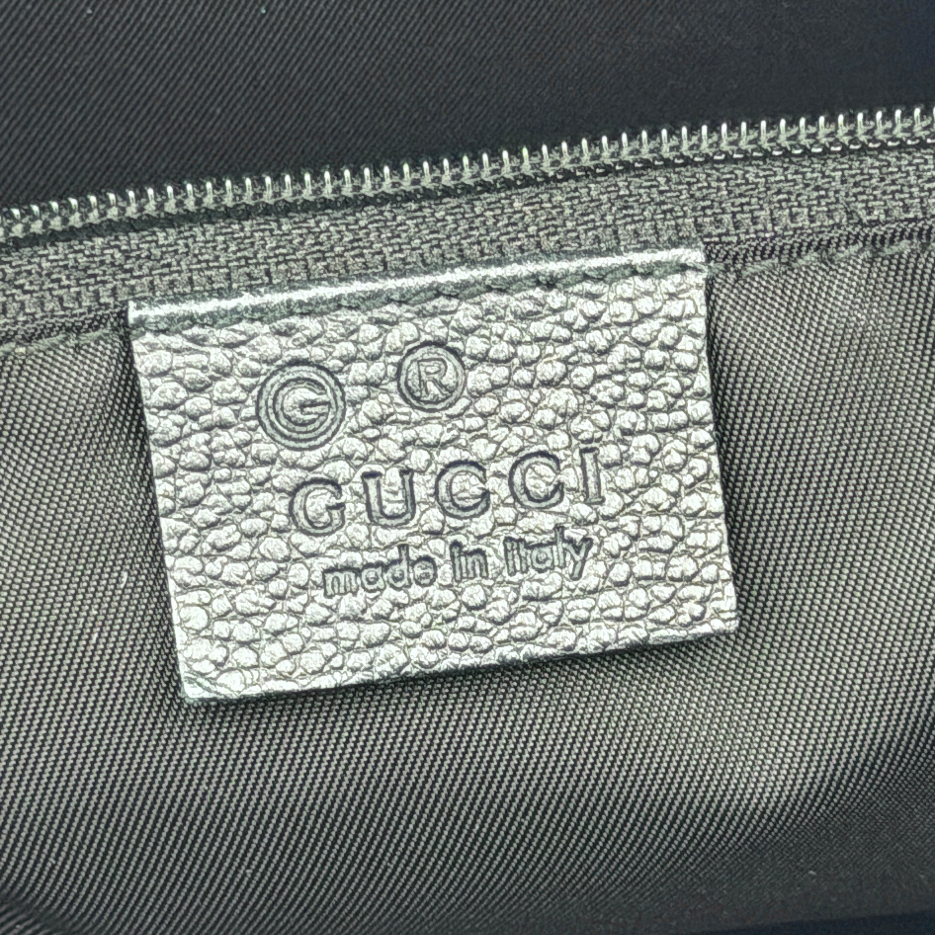 Front-facing view of the Gucci GG Monogram Crystal Boston Bag in grey and black with dual top handles and signature GG canvas.