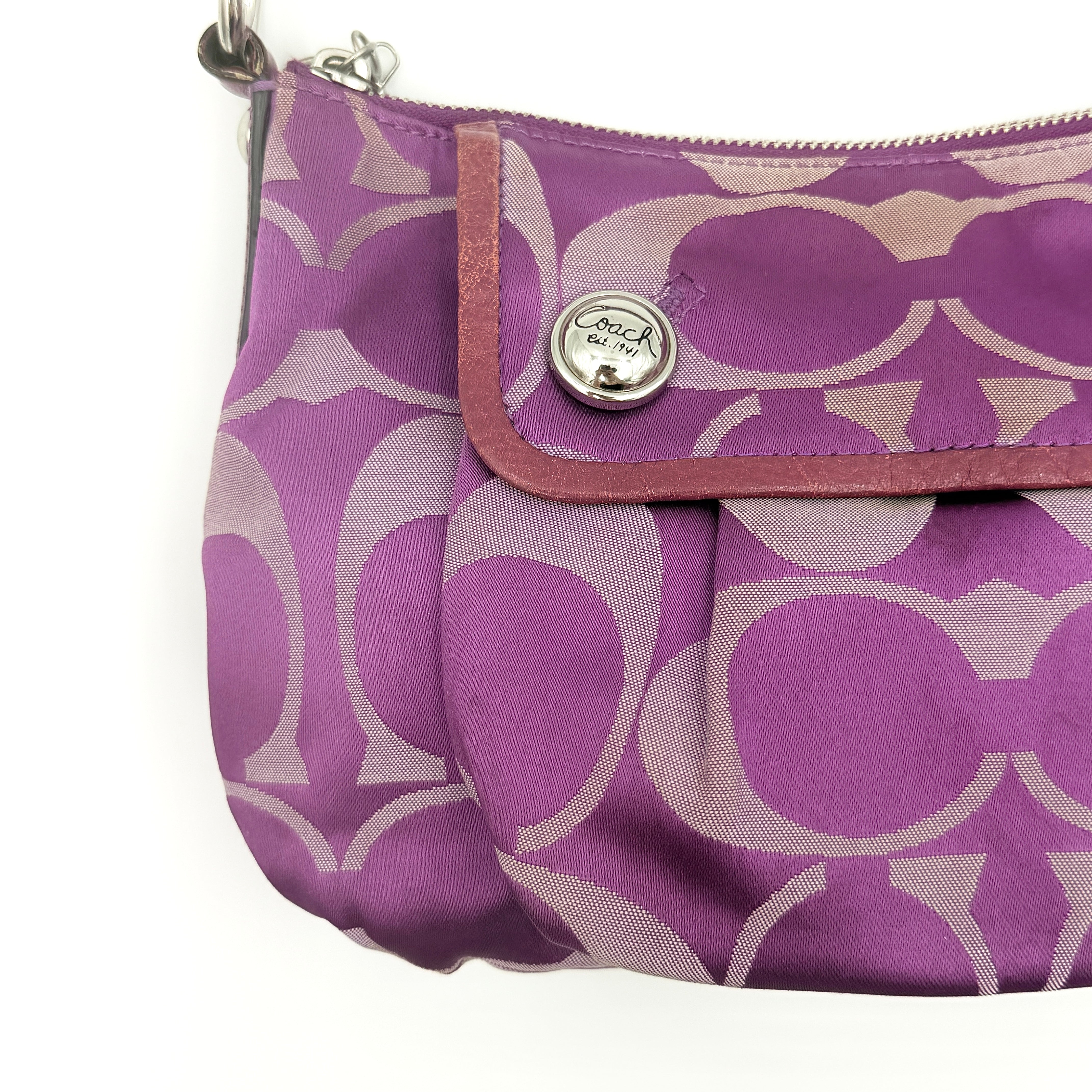Coach 2Way Signature Shoulder Bag in purple canvas with detachable strap and top handle.