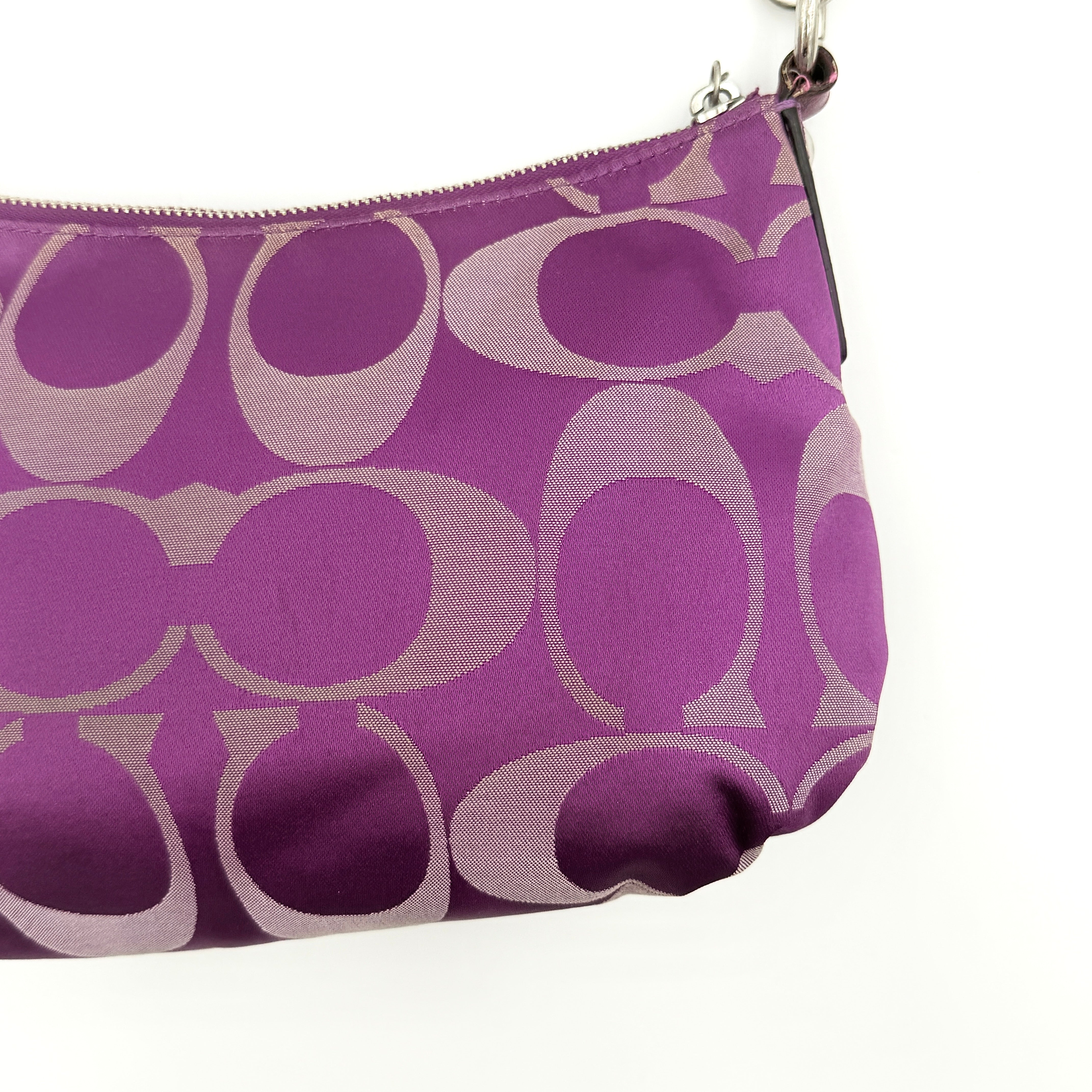 Coach 2Way Signature Shoulder Bag in purple canvas with detachable strap and top handle.