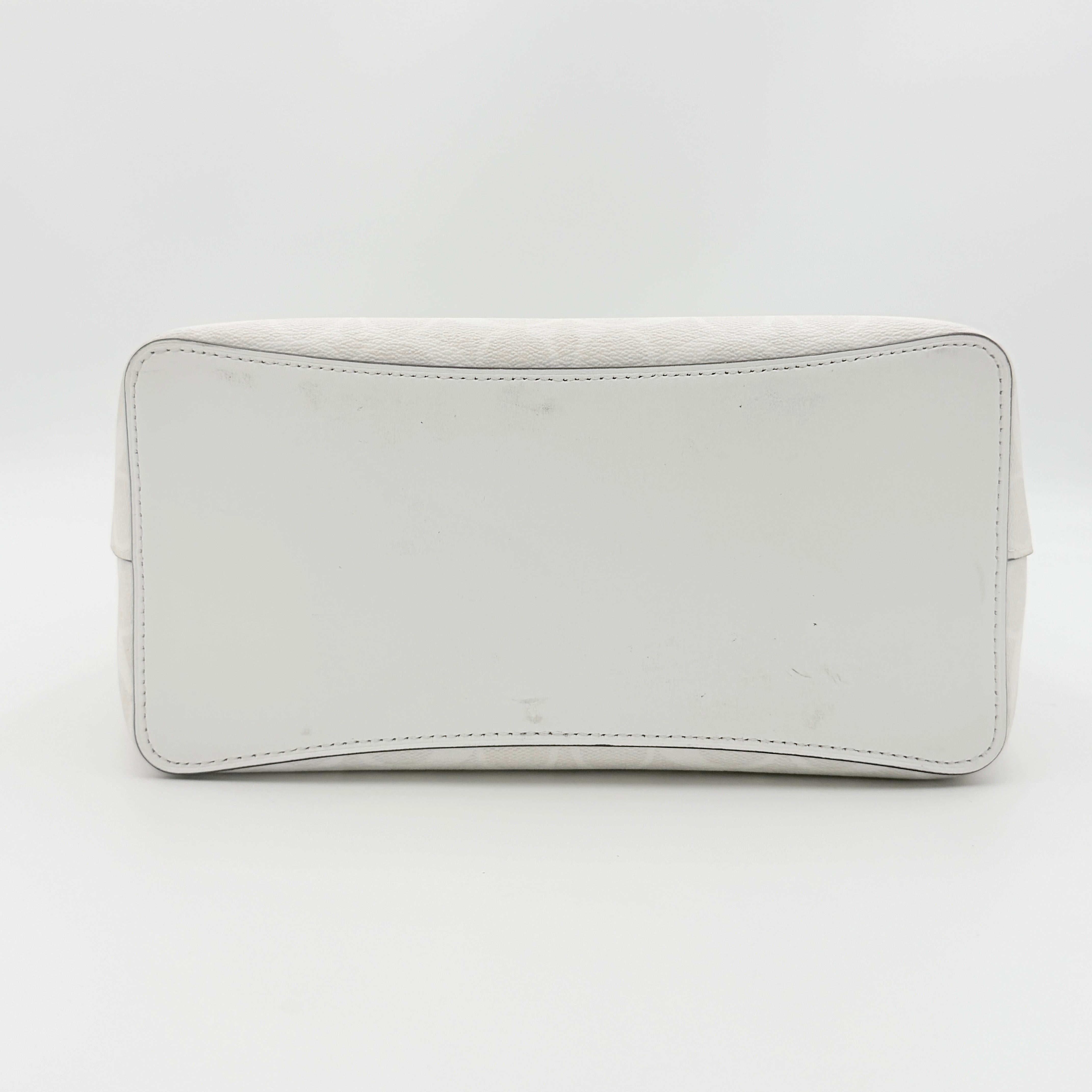 Coach Signature Town Bucket Shoulder Bag in white monogram canvas, shown with detachable strap and gold-tone hardware.