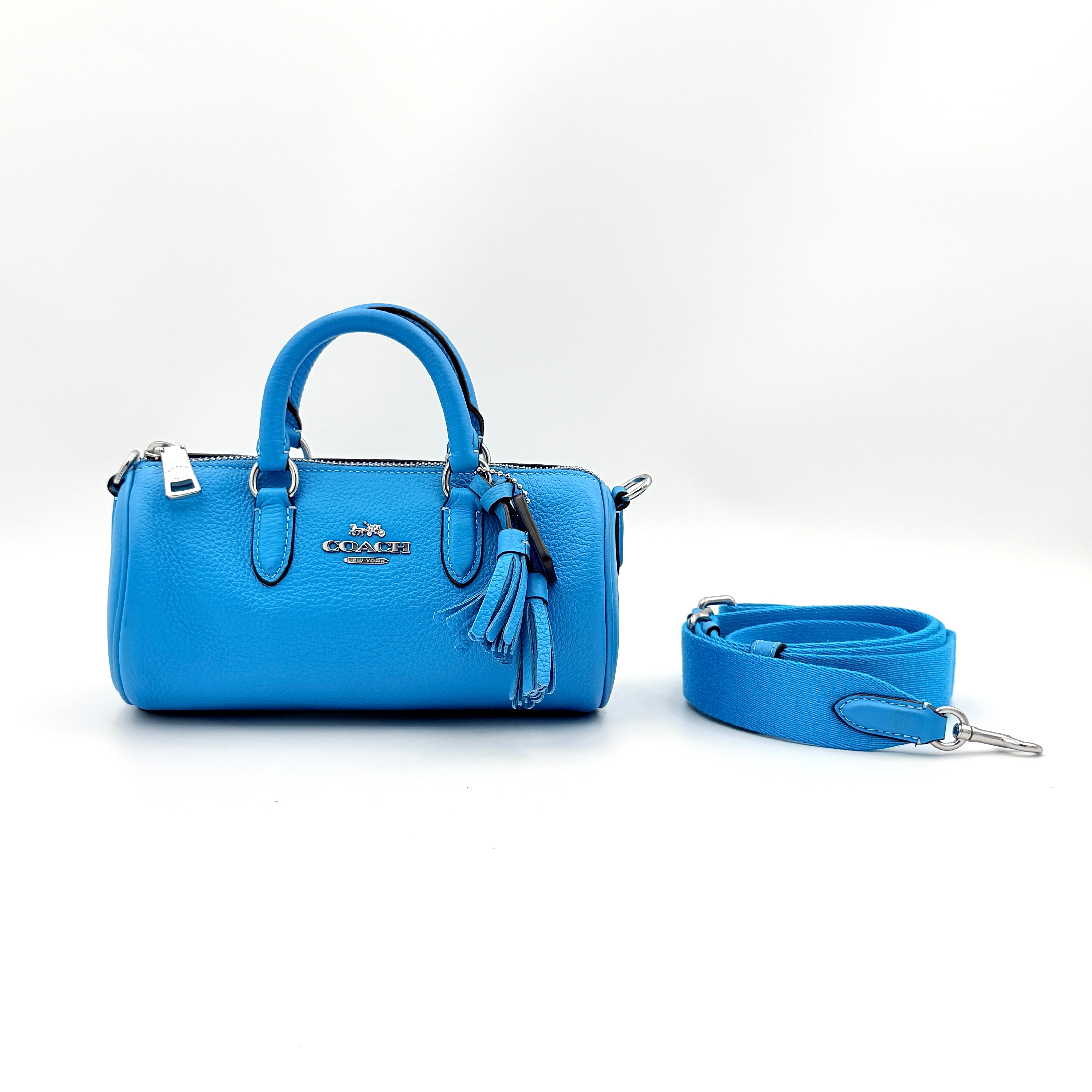 Coach 2Way Lacey Mini Boston Bag in blue pebbled leather with silver hardware and detachable strap, displayed against a clean background.