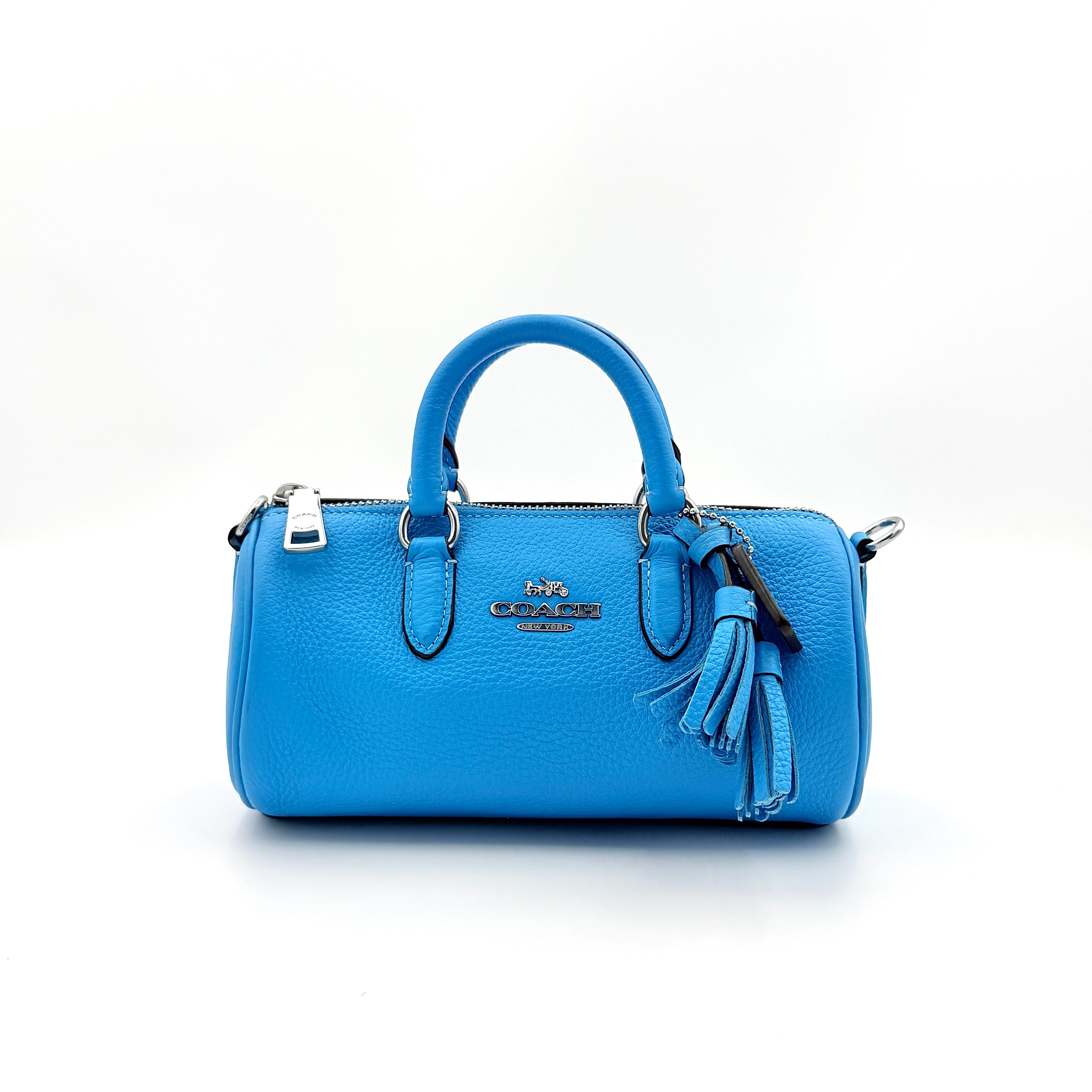 Coach 2Way Lacey Mini Boston Bag in blue pebbled leather with silver hardware and detachable strap, displayed against a clean background.