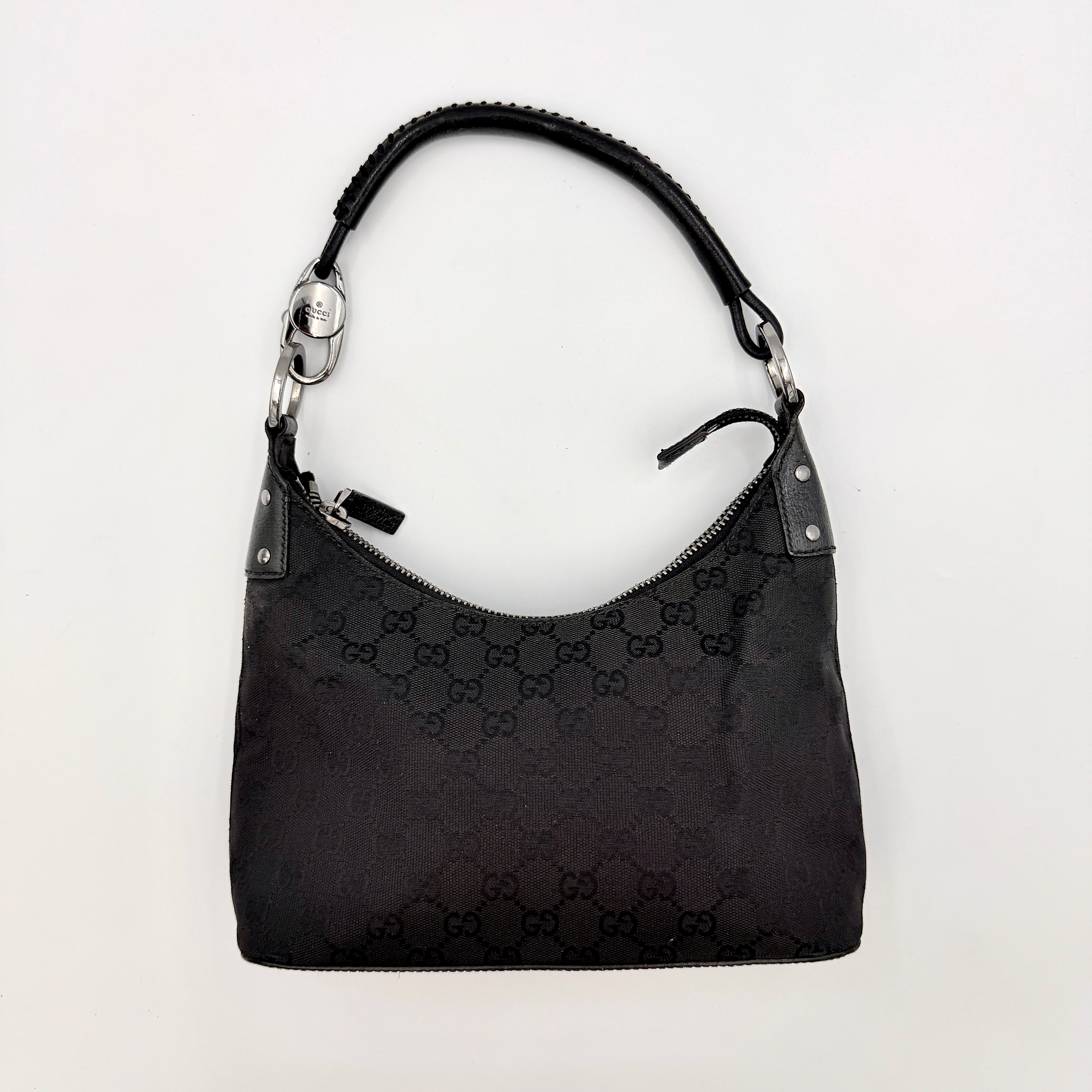 Gucci GG Monogram Lock Hobo Shoulder Bag in black jacquard canvas with leather trim and silver-tone hardware, shown on a white background.