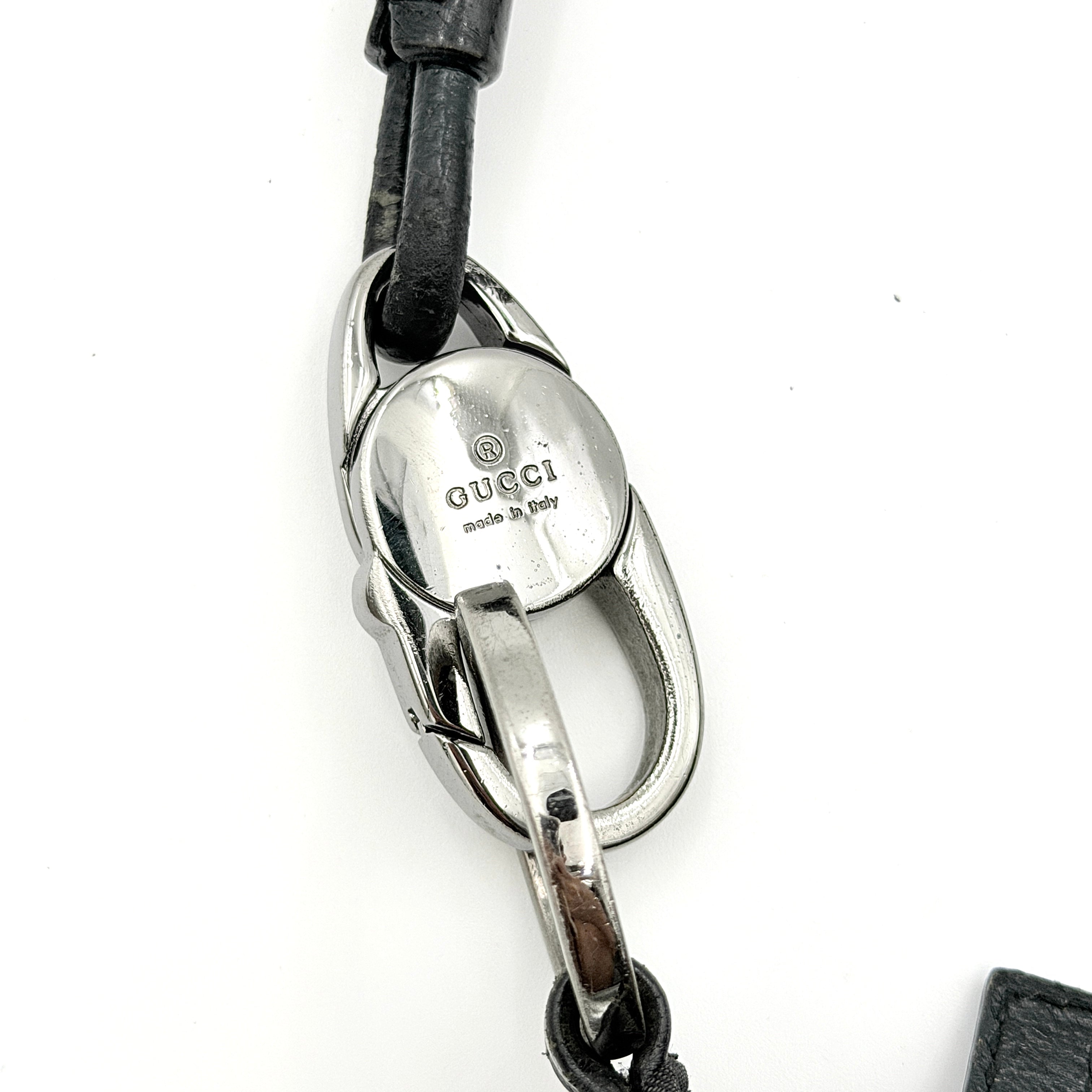 Gucci GG Monogram Lock Hobo Shoulder Bag in black jacquard canvas with leather trim and silver-tone hardware, shown on a white background.