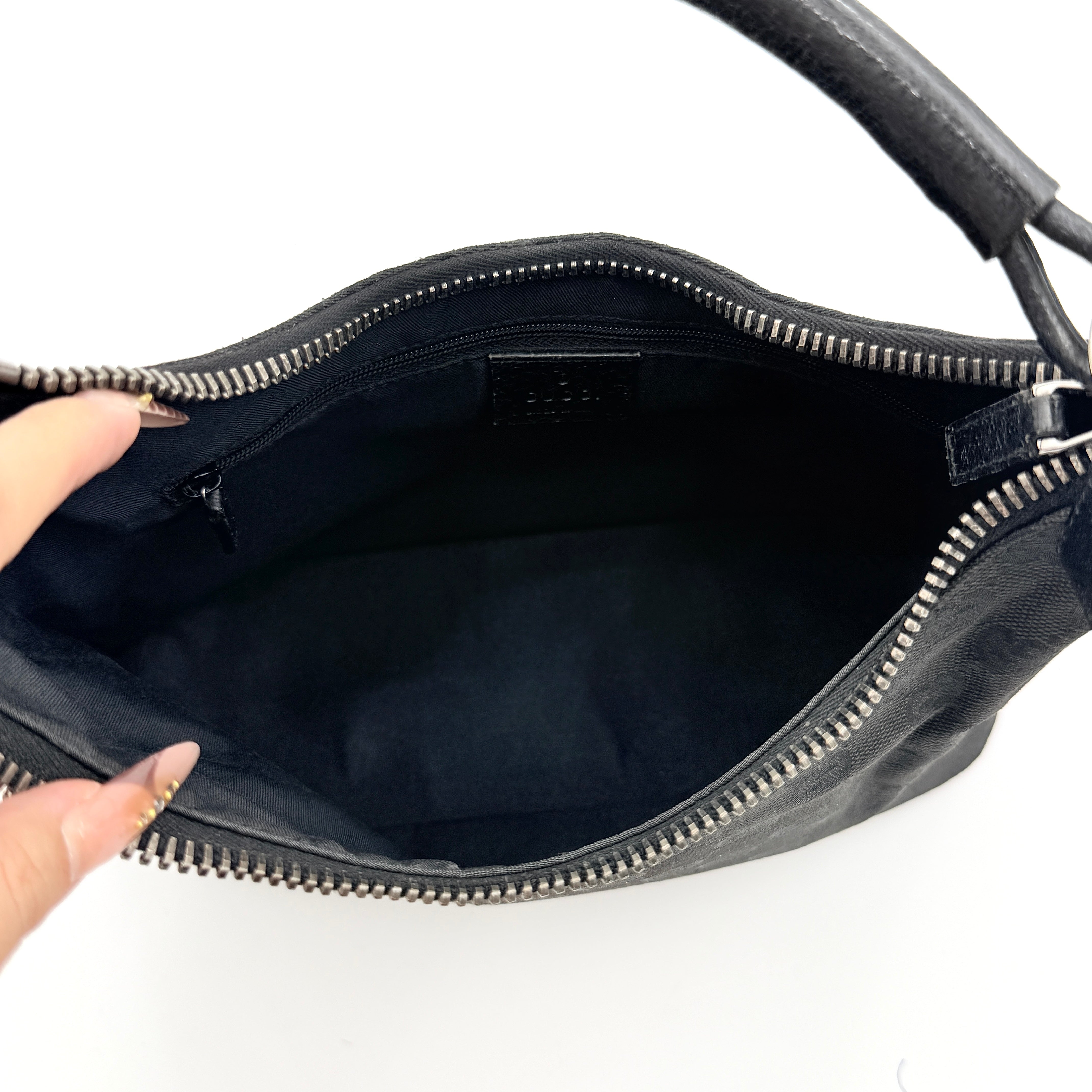 Gucci GG Monogram Lock Hobo Shoulder Bag in black jacquard canvas with leather trim and silver-tone hardware, shown on a white background.