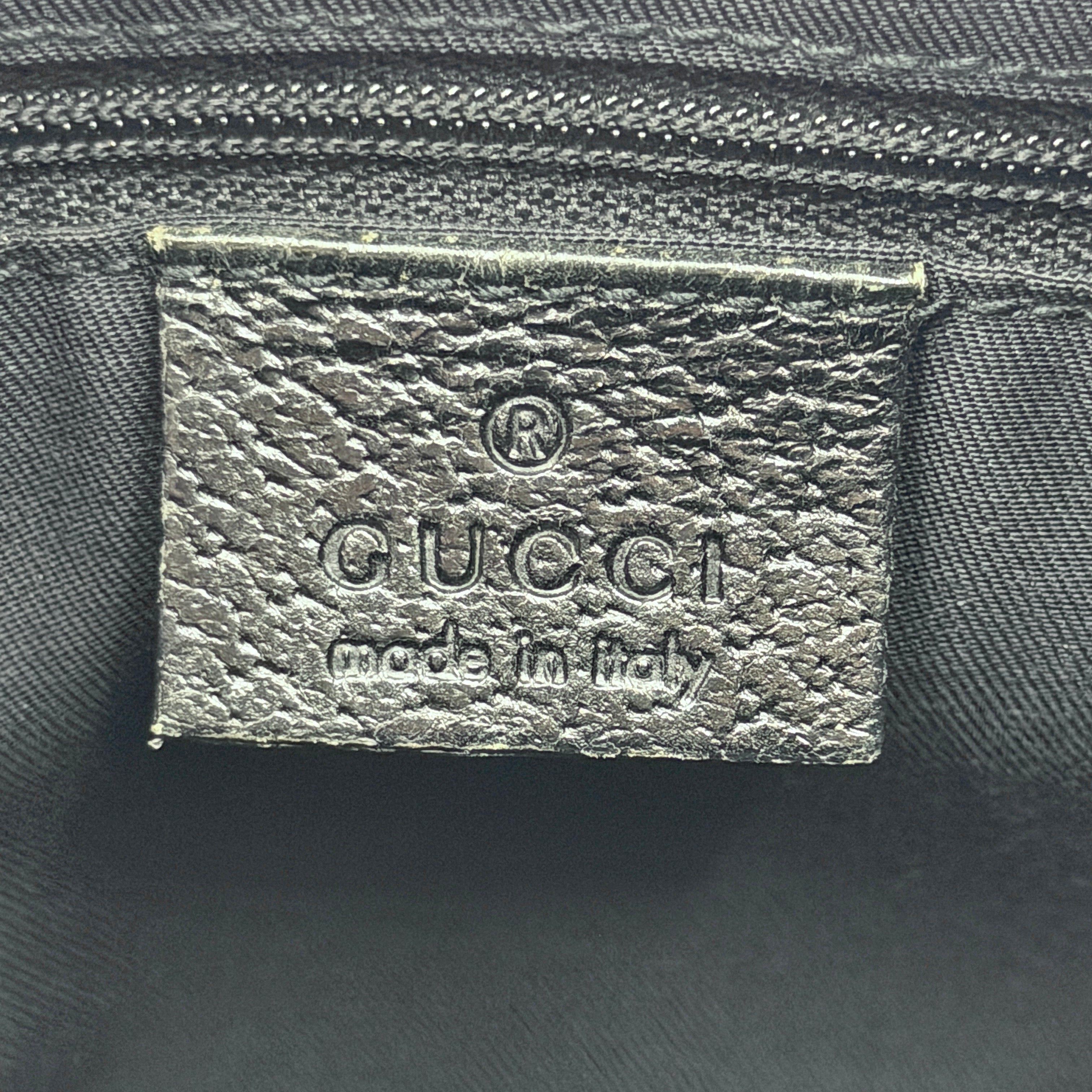 Gucci GG Monogram Lock Hobo Shoulder Bag in black jacquard canvas with leather trim and silver-tone hardware, shown on a white background.