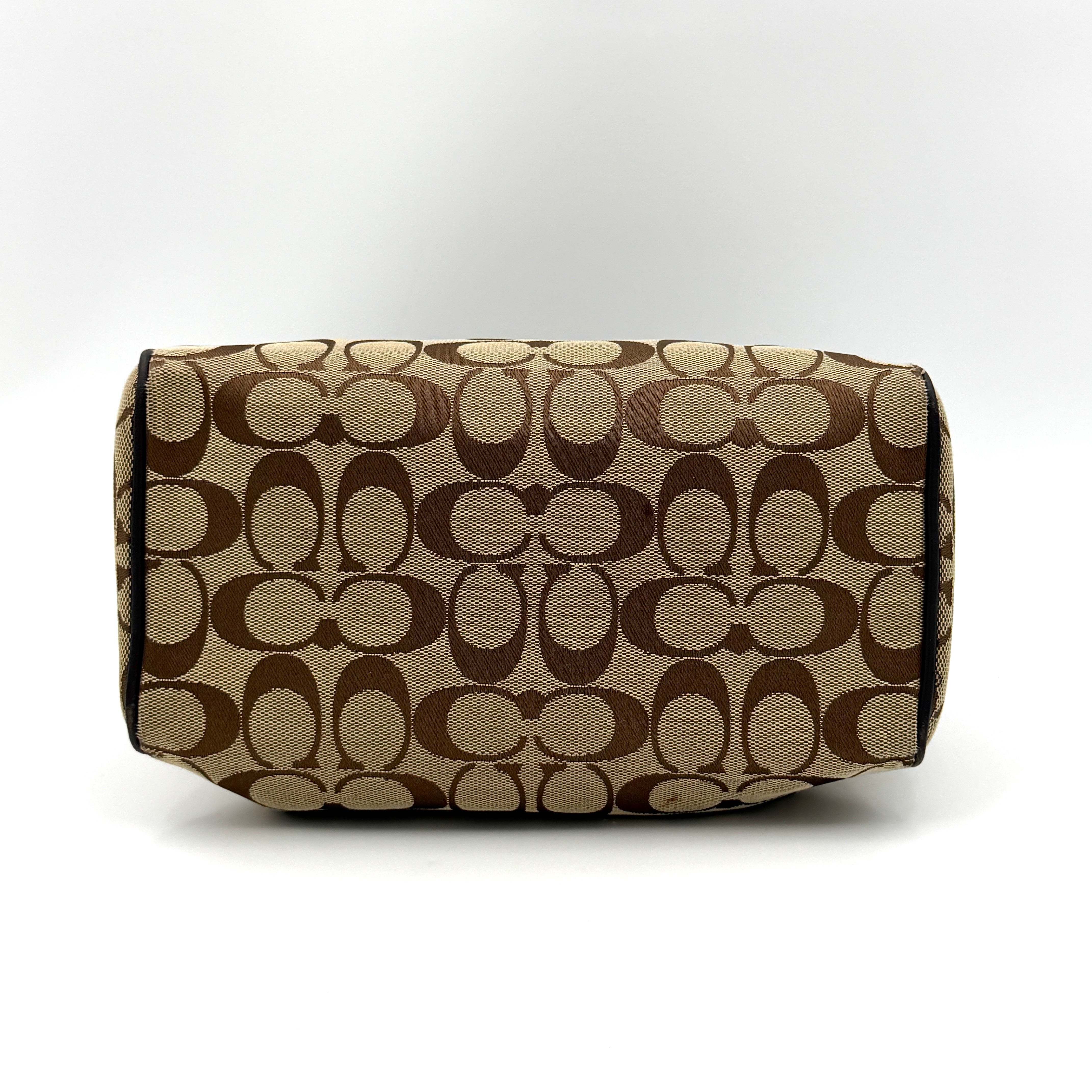 Coach Mini Bennett Boston Bag in beige monogram canvas with brown leather trim, dual handles, and detachable crossbody strap.