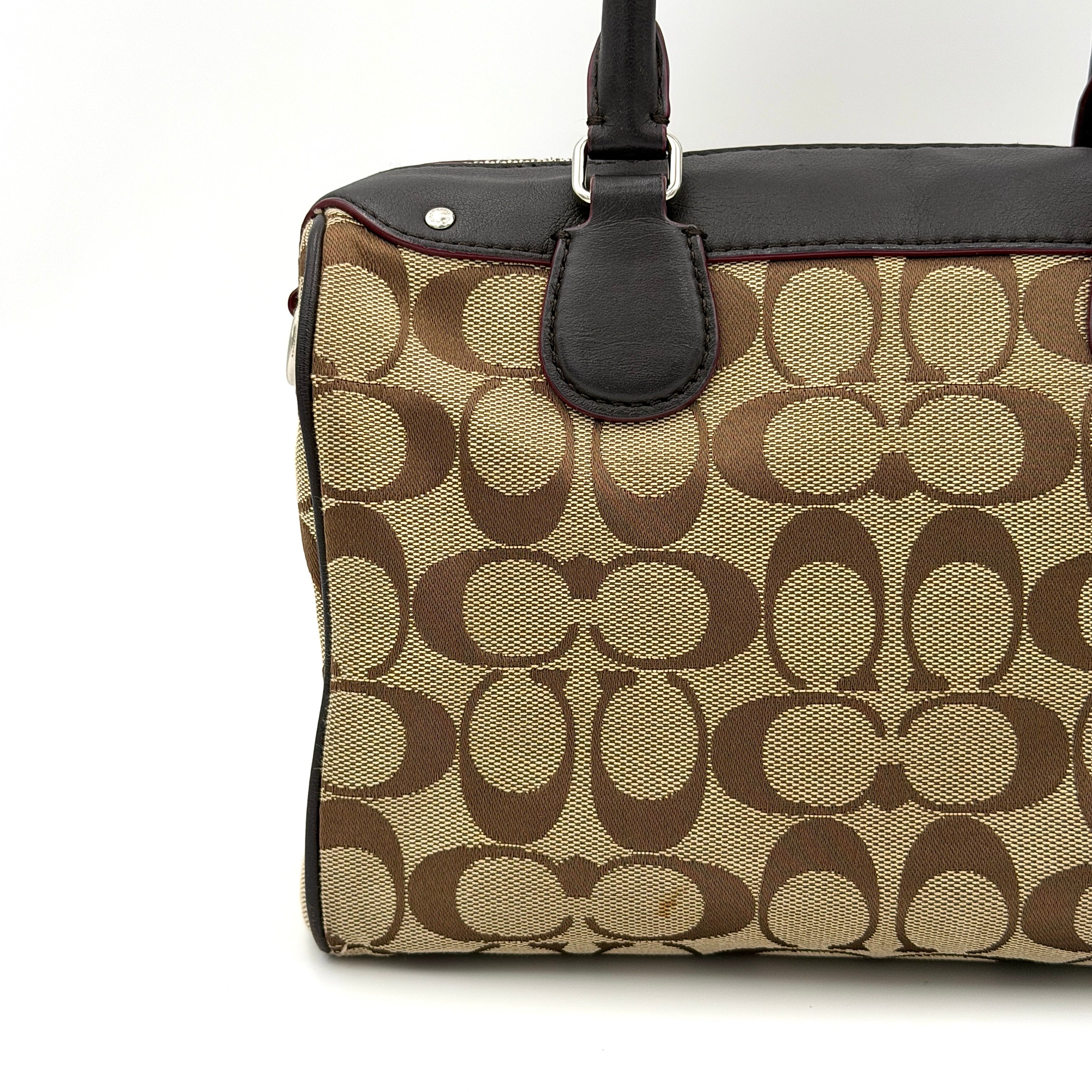 Coach Mini Bennett Boston Bag in beige monogram canvas with brown leather trim, dual handles, and detachable crossbody strap.