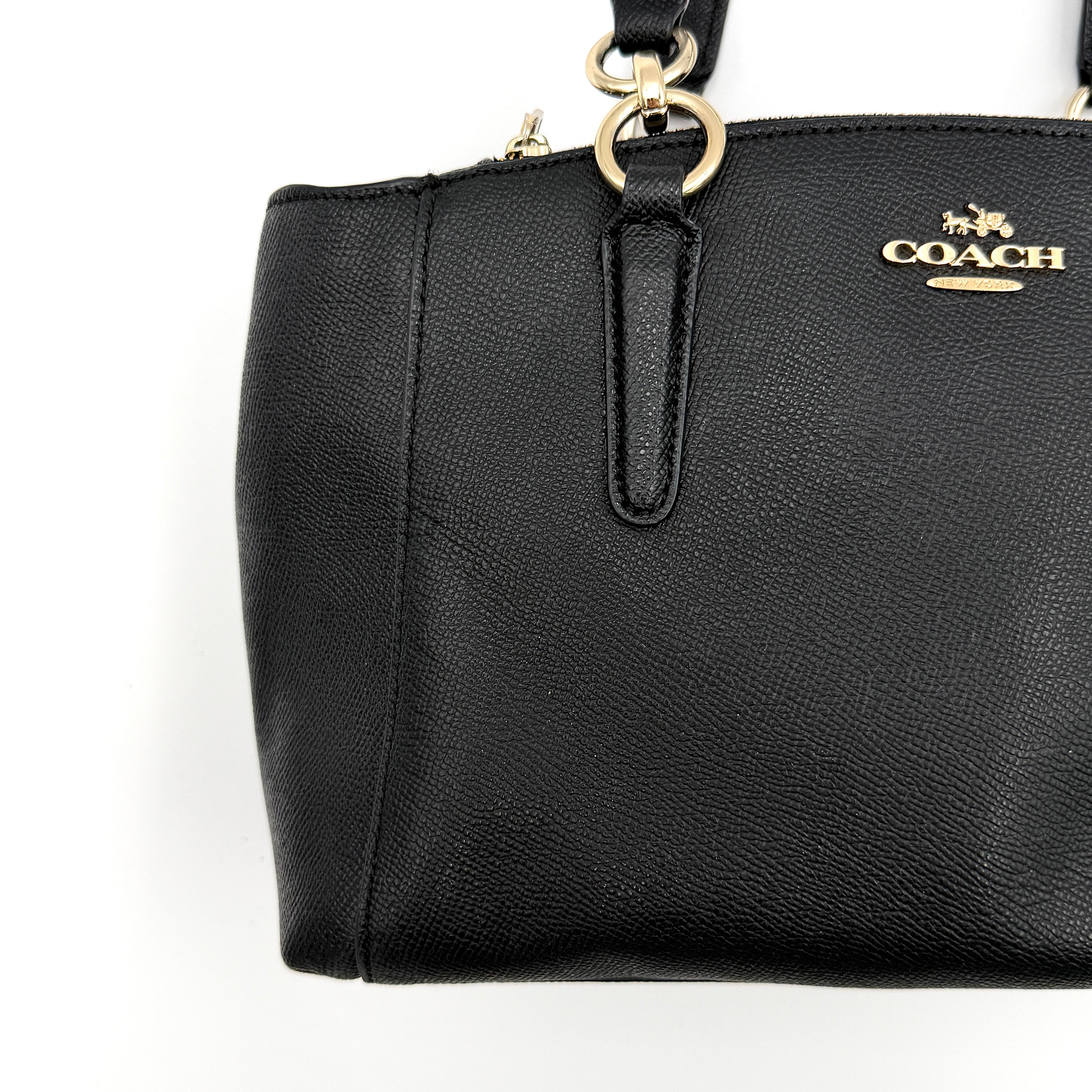 Coach 2Way Christie Carryall Handbag in black leather with gold hardware, detachable strap displayed alongside.