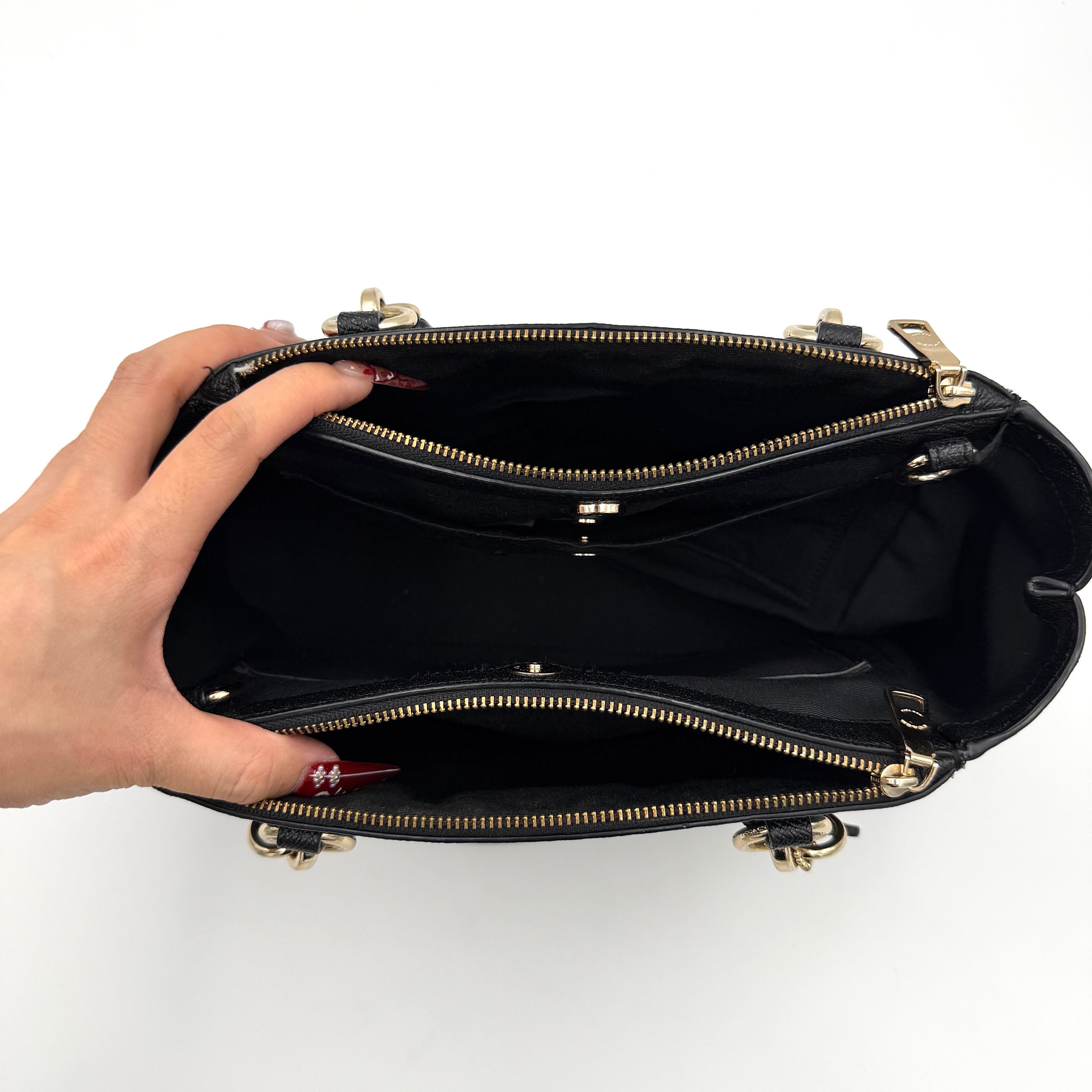 Coach 2Way Christie Carryall Handbag in black leather with gold hardware, detachable strap displayed alongside.