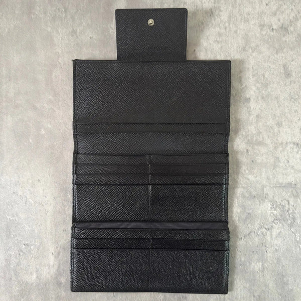 Bvlgari Classico Long Wallet in black leather, featuring a silver-tone logo clasp, multiple card slots, and a spacious bill compartment, showcasing understated luxury and sophistication.