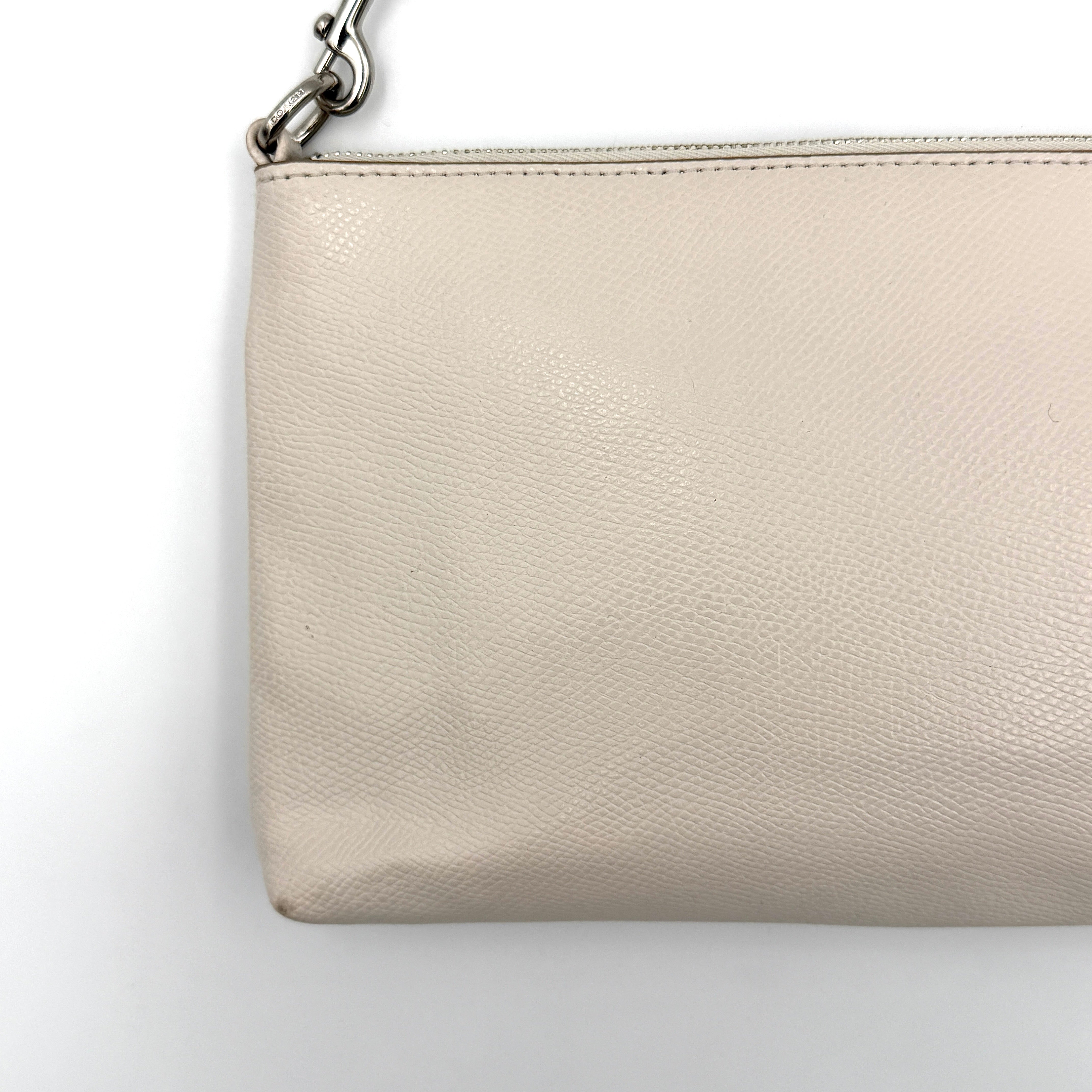 Coach 2in1 Floral Pop Pouch Shoulder Bag in ivory leather with detachable top handle and silver hardware, featuring a navy floral printed insert.