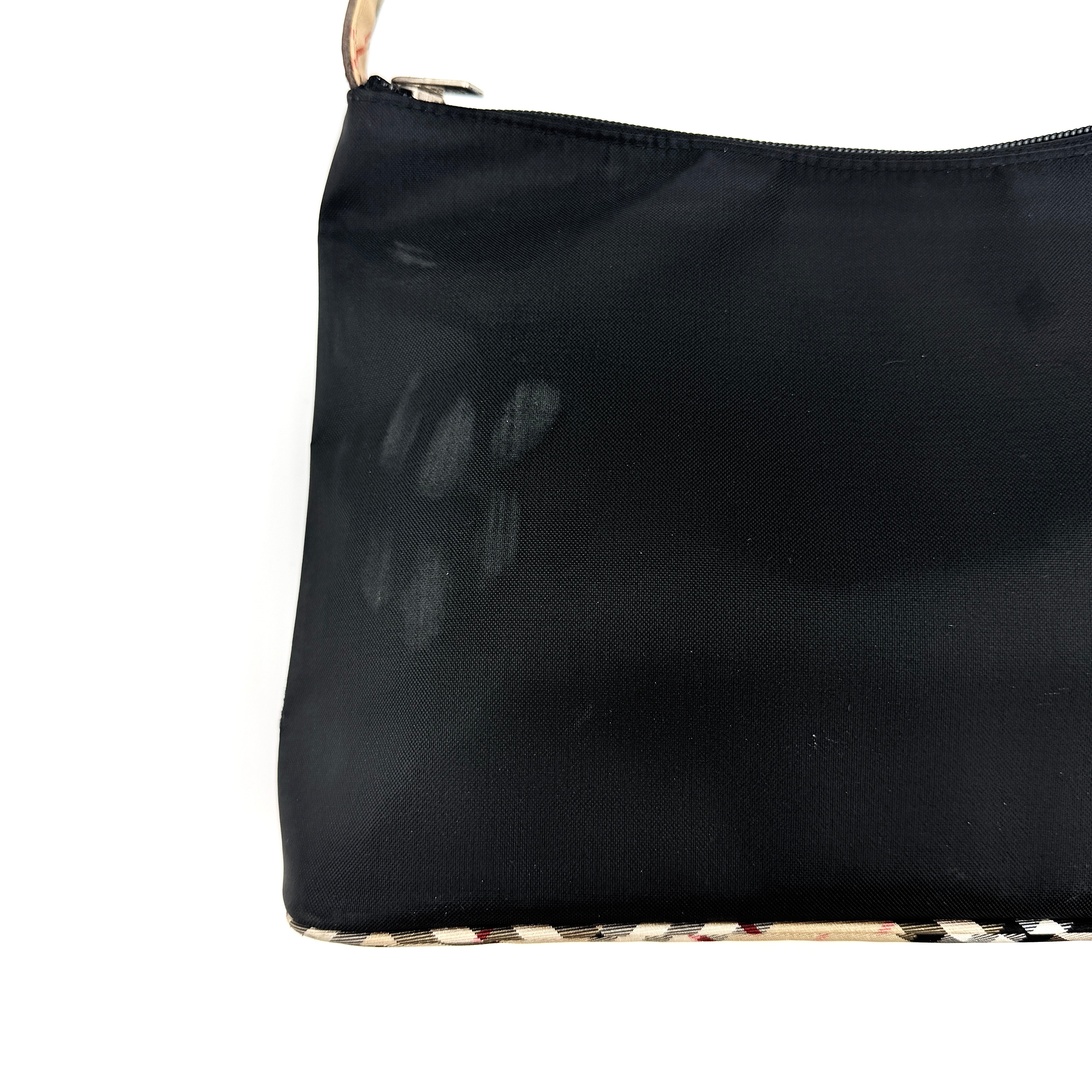 Front-facing Burberry Nova Check Nylon Shoulder Bag in black with Nova Check strap and base, shown against a clean background.