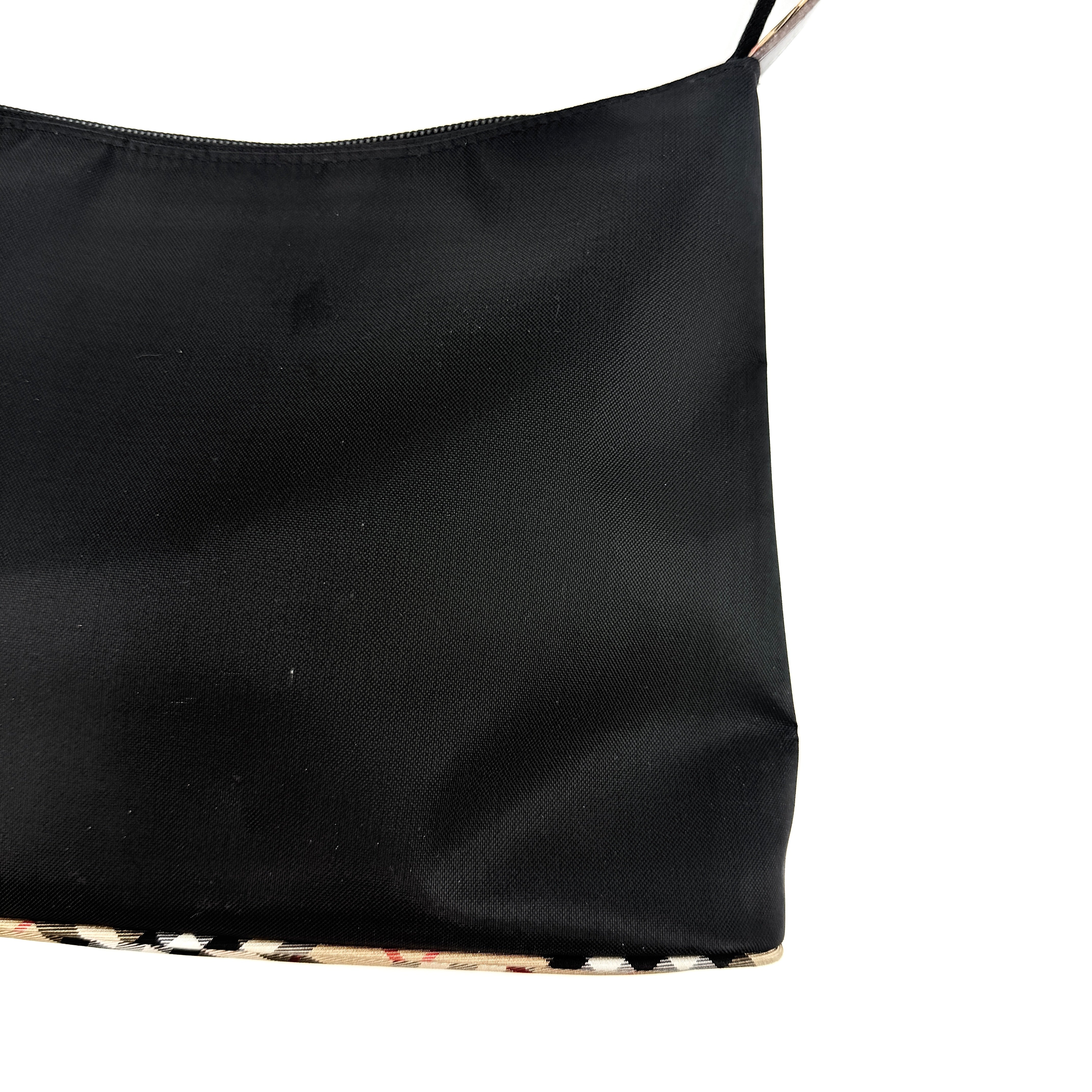 Front-facing Burberry Nova Check Nylon Shoulder Bag in black with Nova Check strap and base, shown against a clean background.
