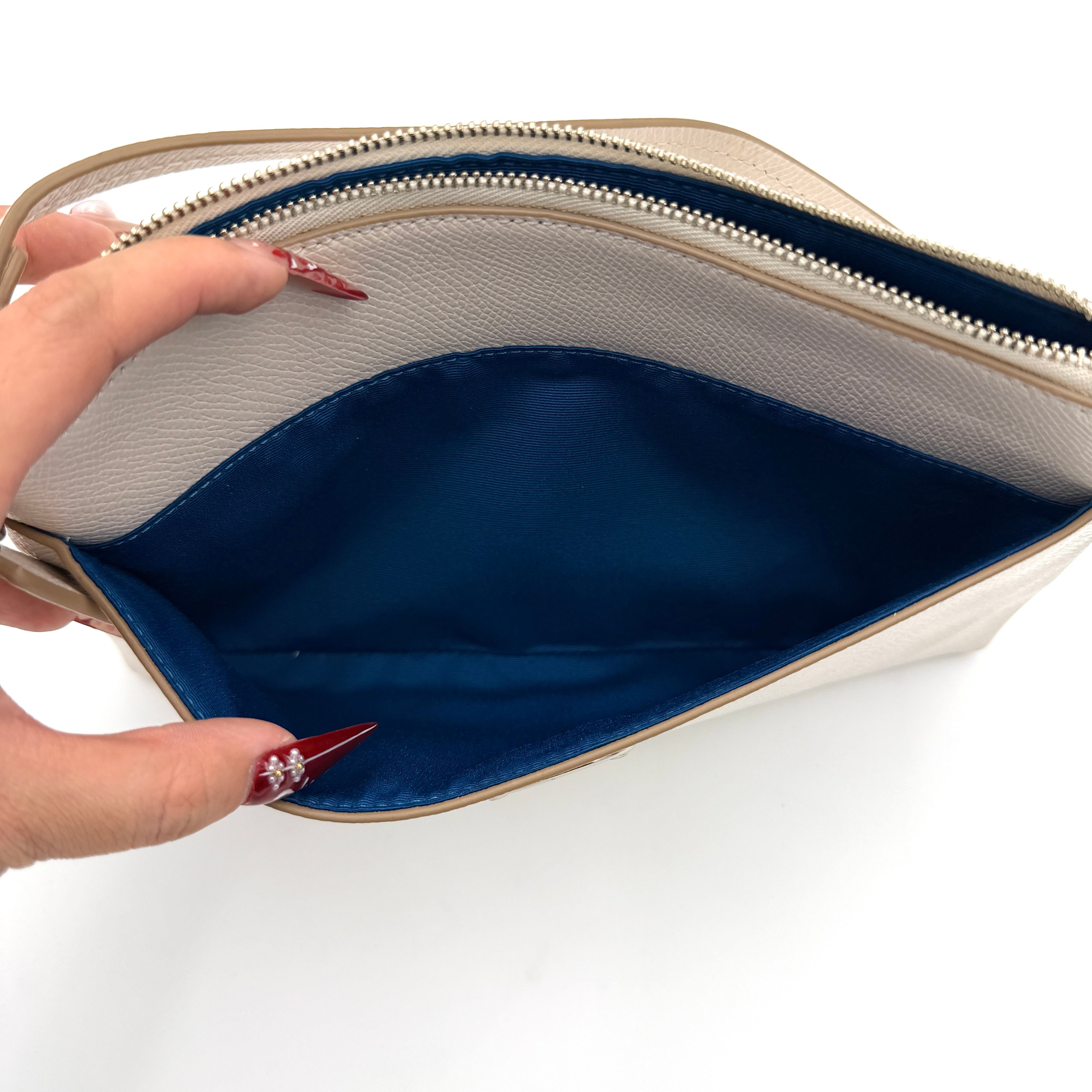 Coach 2in1 Floral Pop Pouch Shoulder Bag in ivory leather with detachable top handle and silver hardware, featuring a navy floral printed insert.