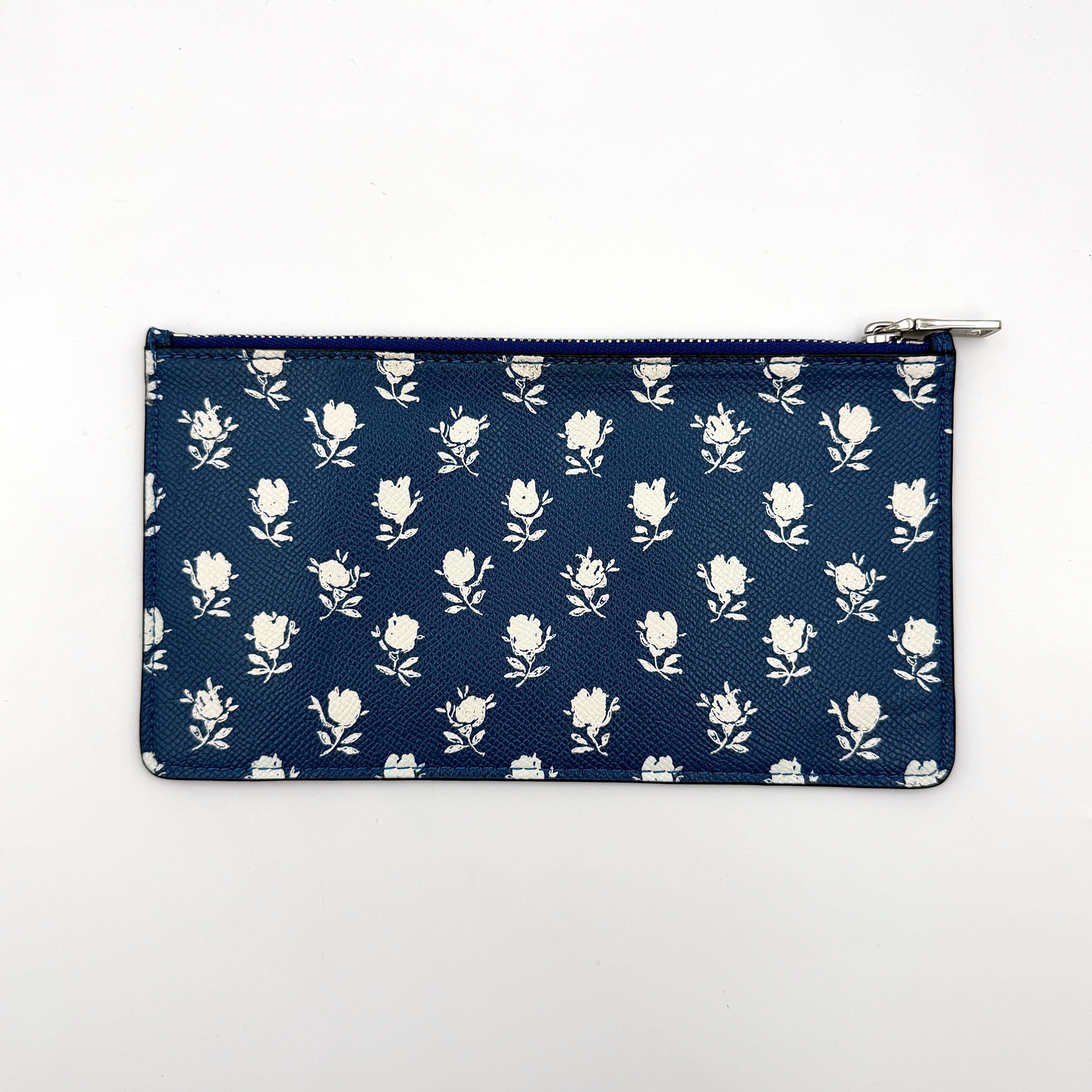 Coach 2in1 Floral Pop Pouch Shoulder Bag in ivory leather with detachable top handle and silver hardware, featuring a navy floral printed insert.