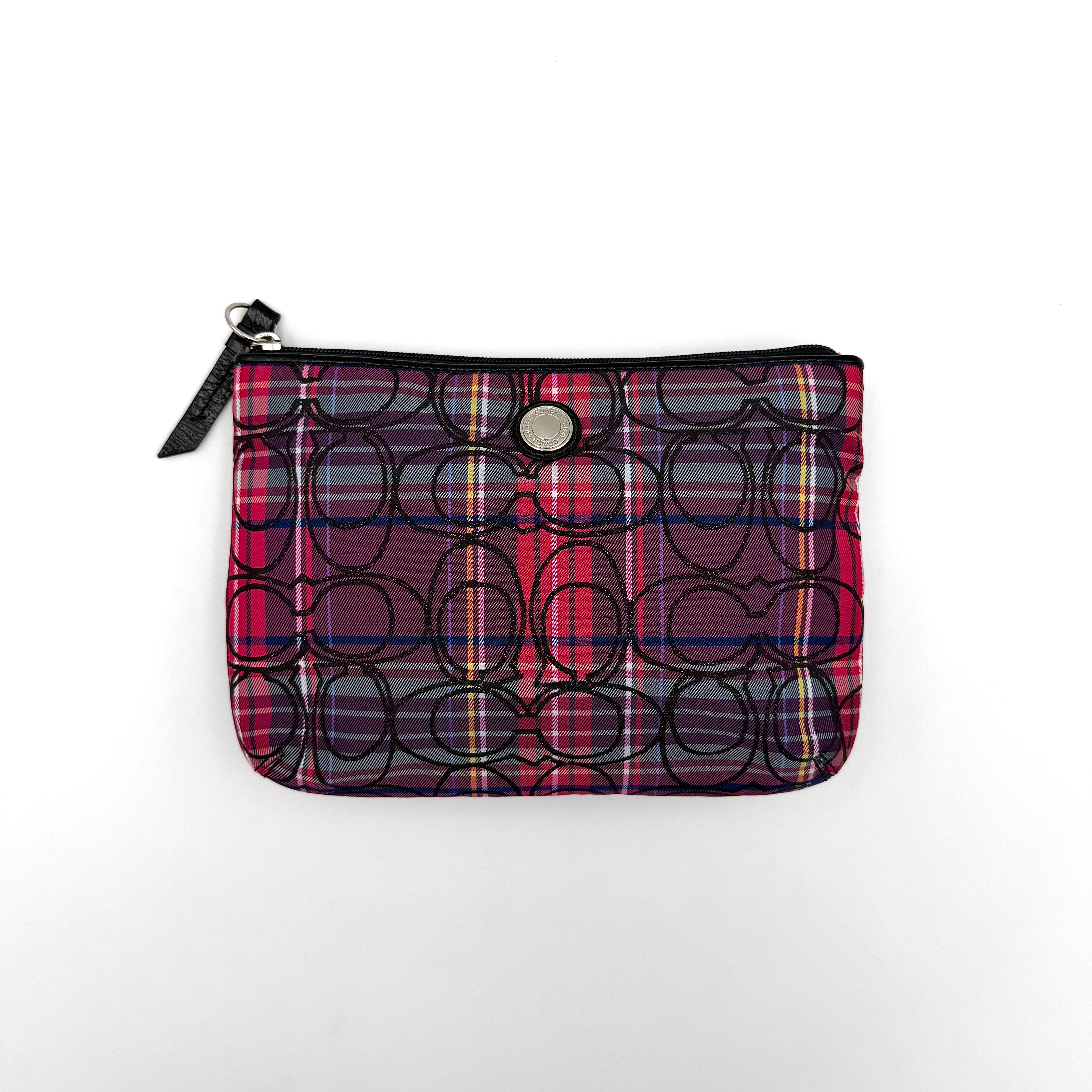 Coach Signature Poppy Tartan Pouch with bold multicolour plaid and black C motif, topped by silver-tone hardware and leather zipper pull.