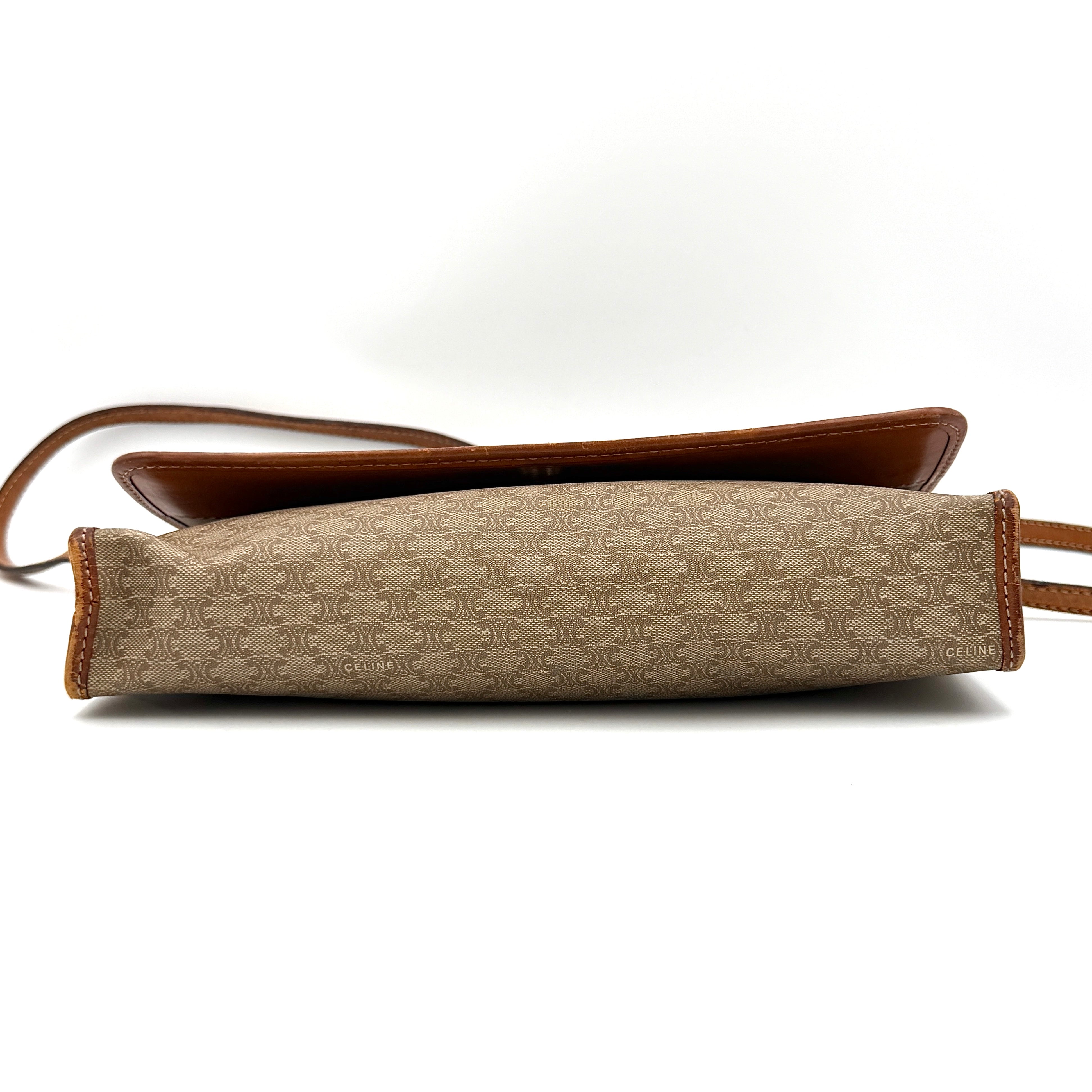 Celine Macadam PVC Crossbody Bag in brown and beige with a monogram pattern, tan leather trim, and long crossbody strap displayed against a white background.