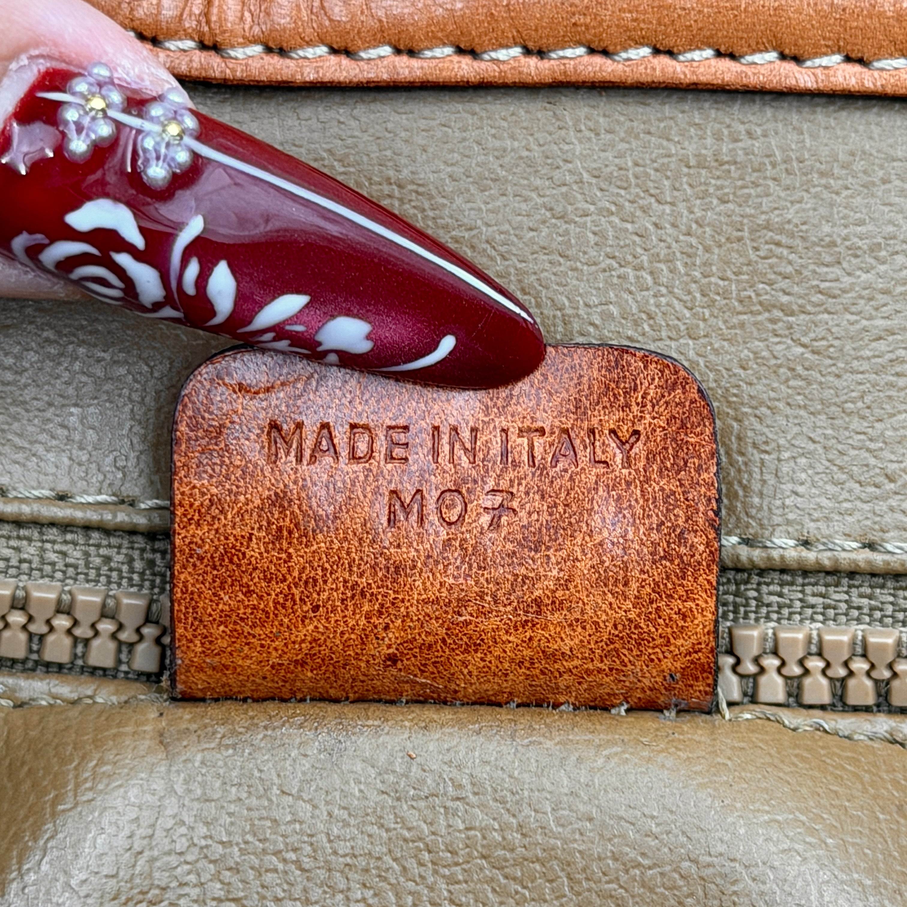 Celine Macadam PVC Crossbody Bag in brown and beige with a monogram pattern, tan leather trim, and long crossbody strap displayed against a white background.