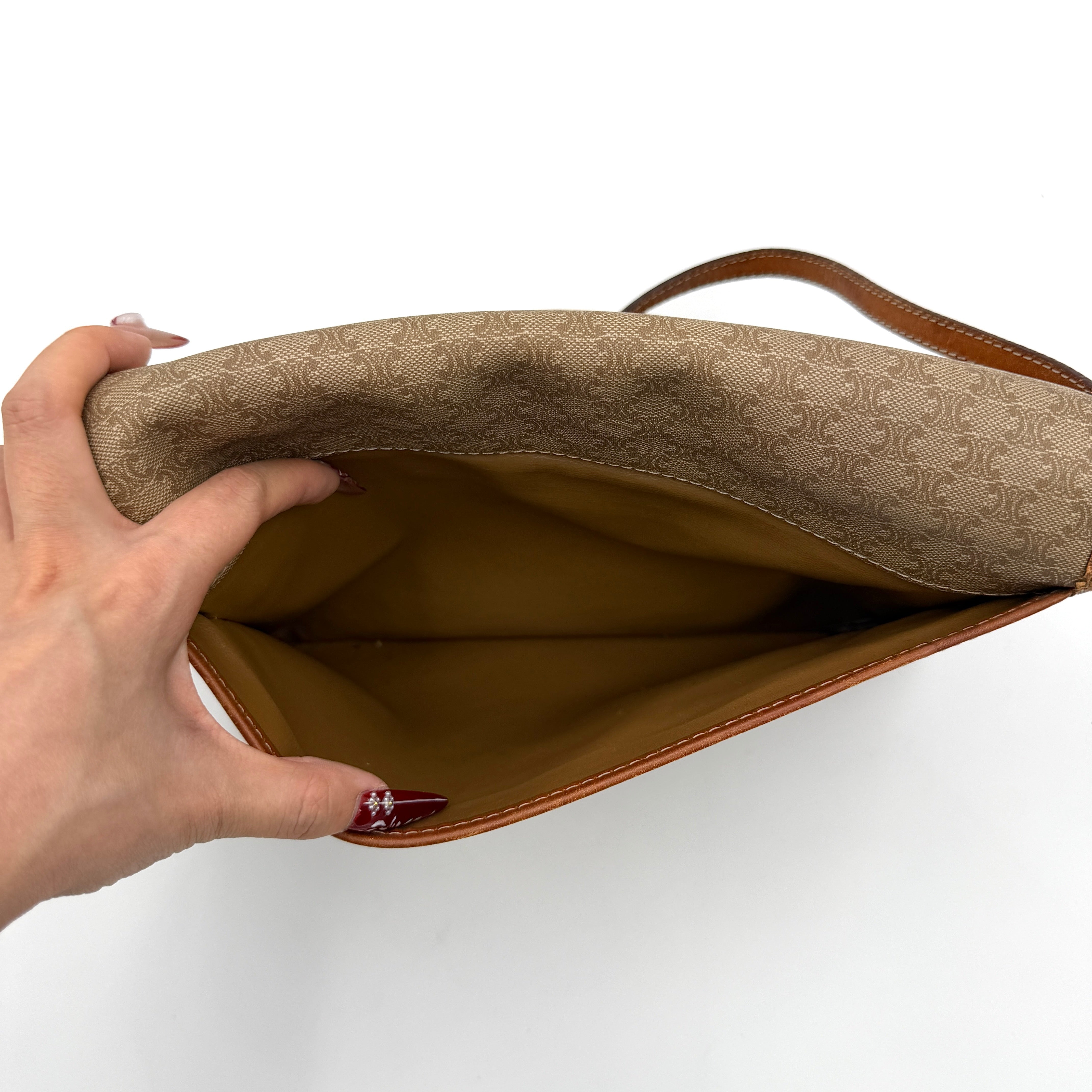 Celine Macadam PVC Crossbody Bag in brown and beige with a monogram pattern, tan leather trim, and long crossbody strap displayed against a white background.