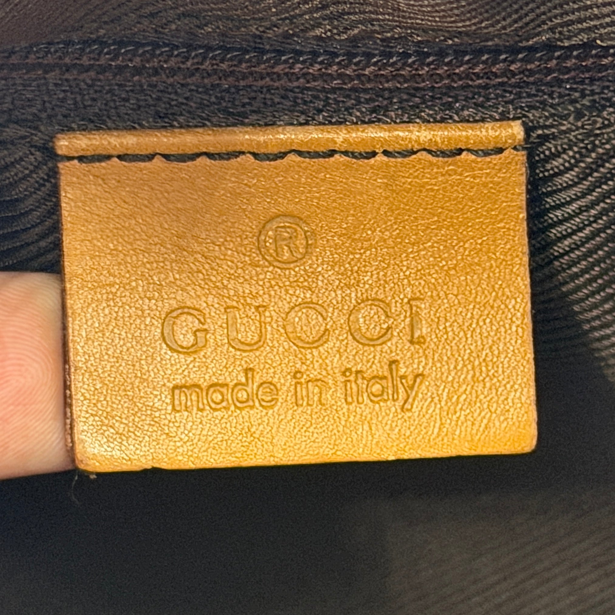 Gucci Abbey Mini Boston shoulder bag in beige GG monogram canvas with caramel leather trim and silver-tone hardware.