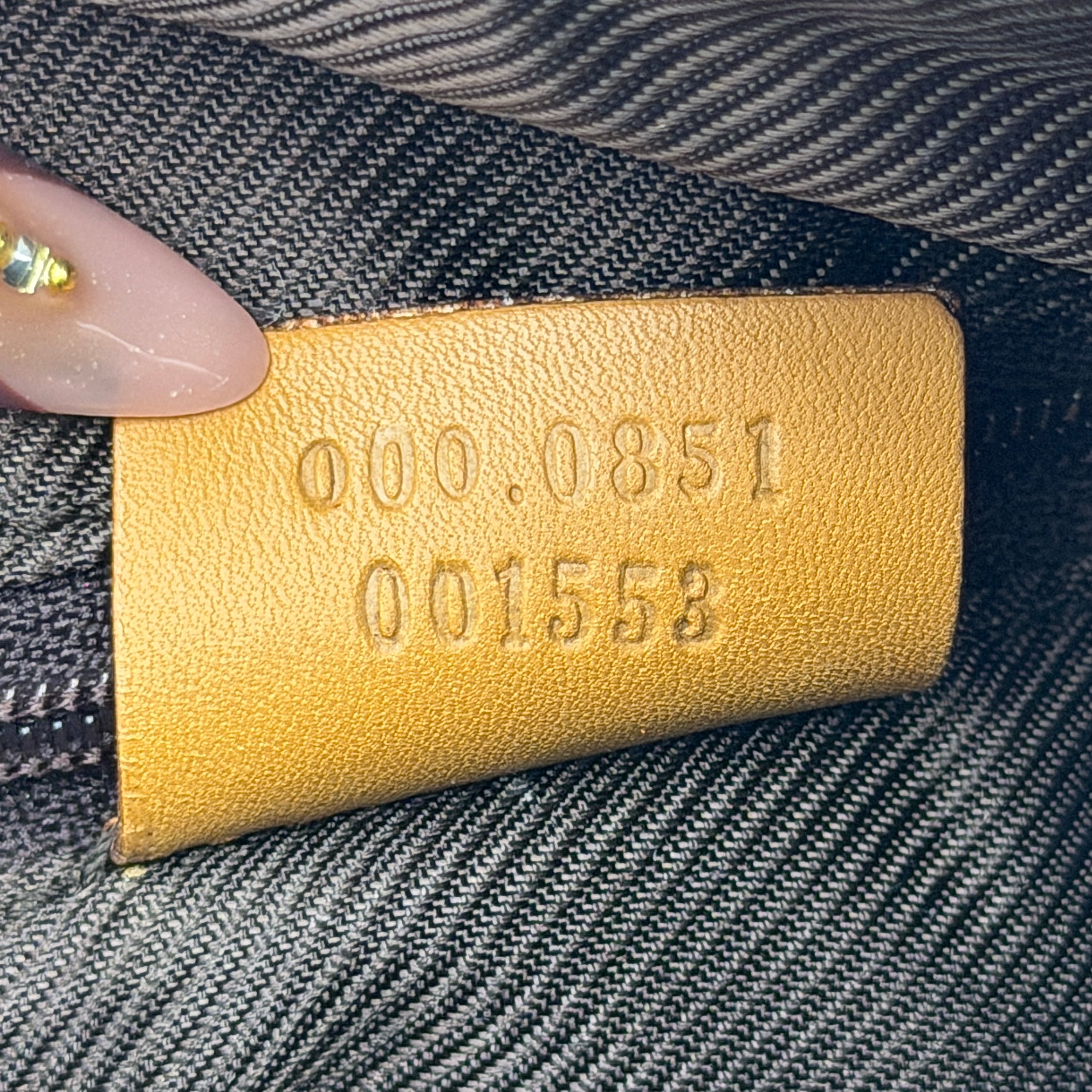 Gucci Abbey Mini Boston shoulder bag in beige GG monogram canvas with caramel leather trim and silver-tone hardware.