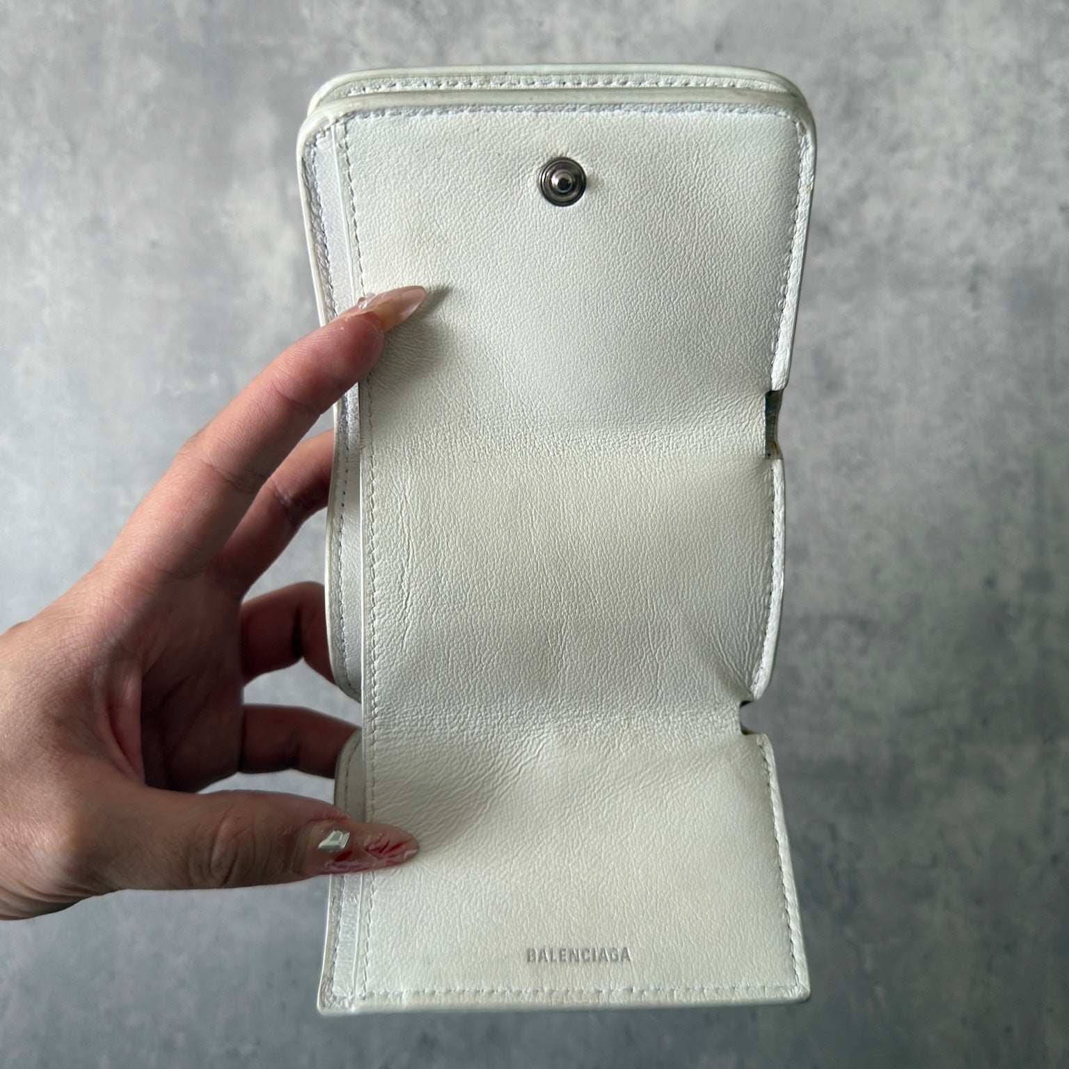 Balenciaga BB Logo Mini Tri-fold White Leather Wallet with silver BB logo, showcasing internal compartments and minimal wear.