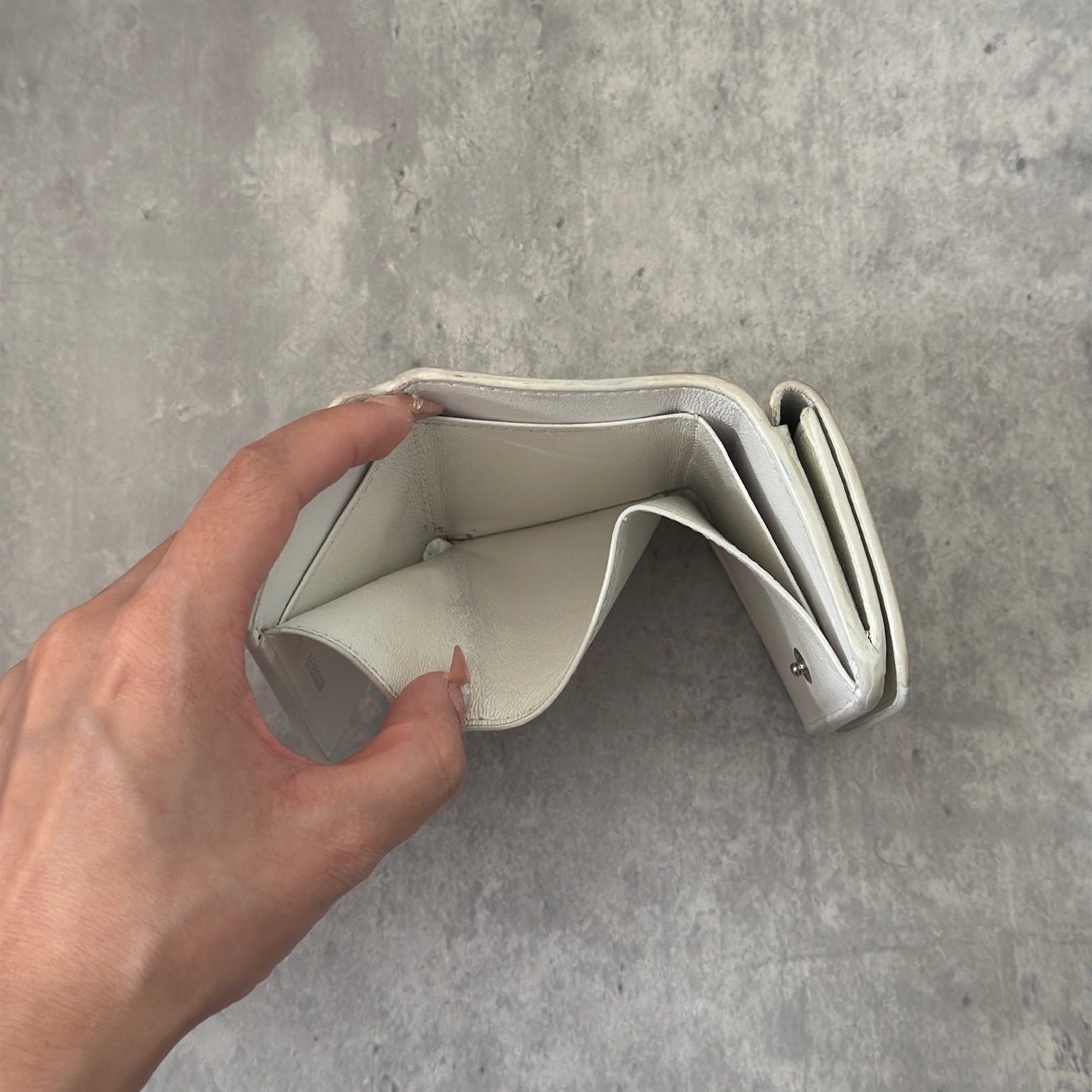 Balenciaga BB Logo Mini Tri-fold White Leather Wallet with silver BB logo, showcasing internal compartments and minimal wear.