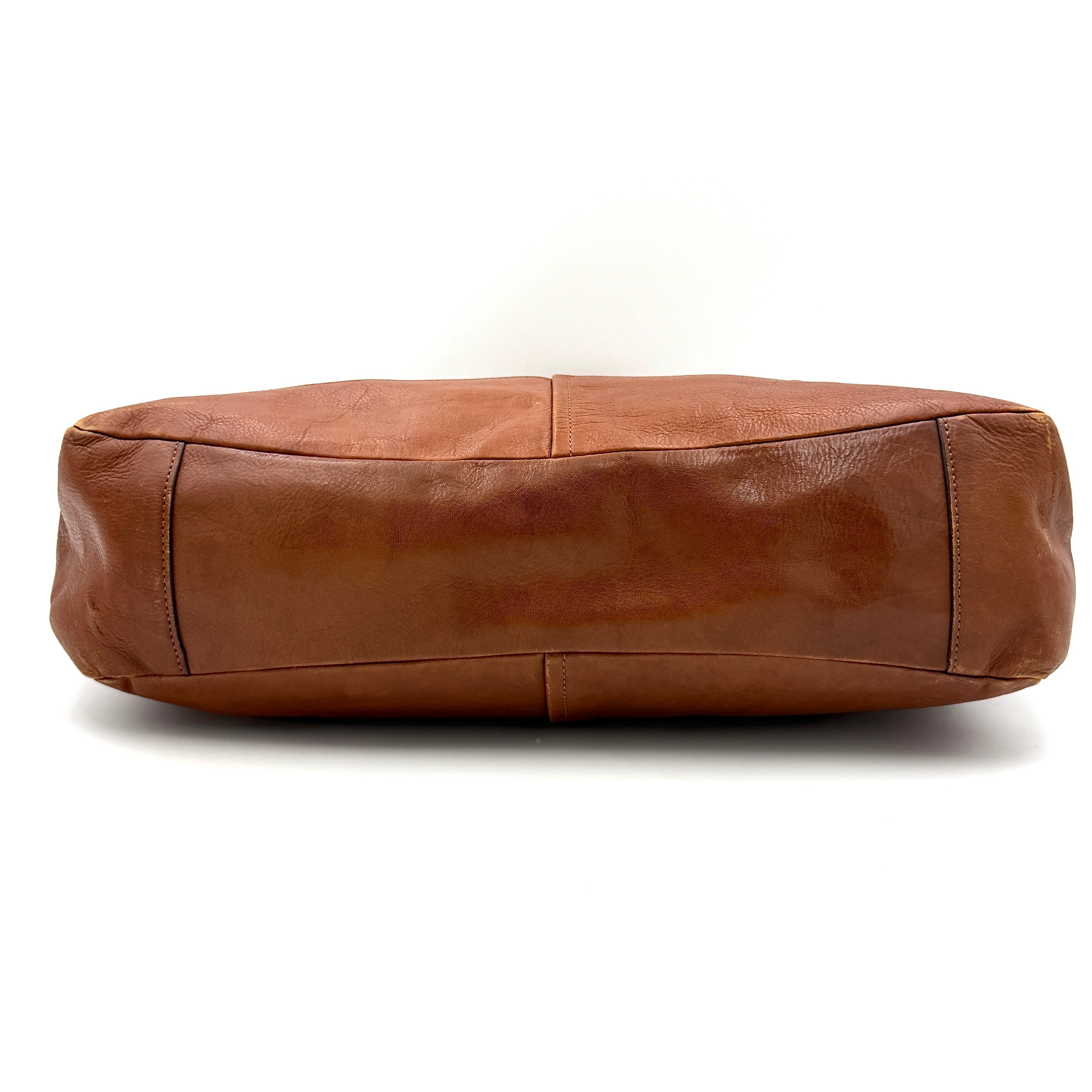 Coach Chelsea Jayden Shoulder Bag in rich brown grained leather, with gold-tone turn-lock and subtle pleated detailing.
