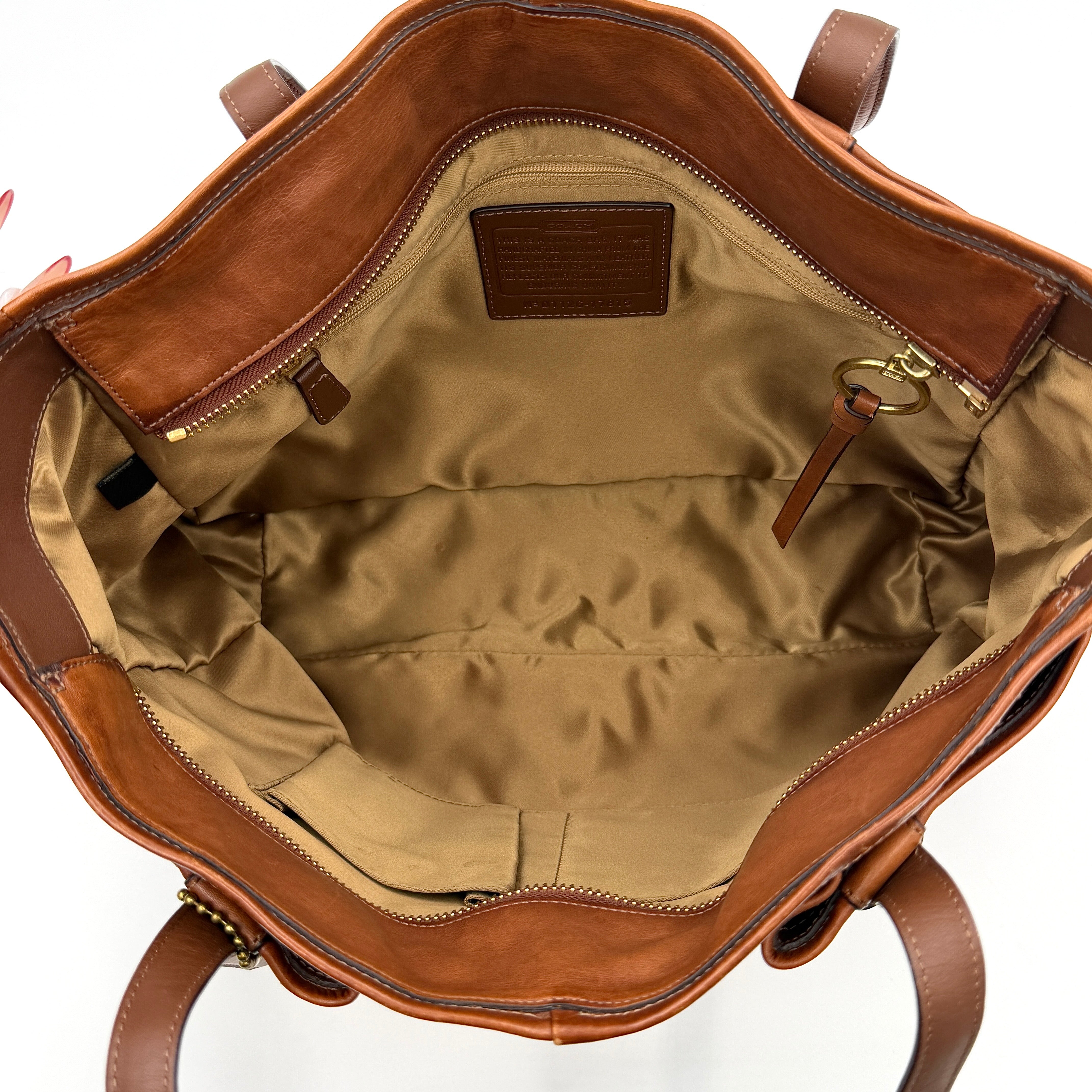 Coach Chelsea Jayden Shoulder Bag in rich brown grained leather, with gold-tone turn-lock and subtle pleated detailing.