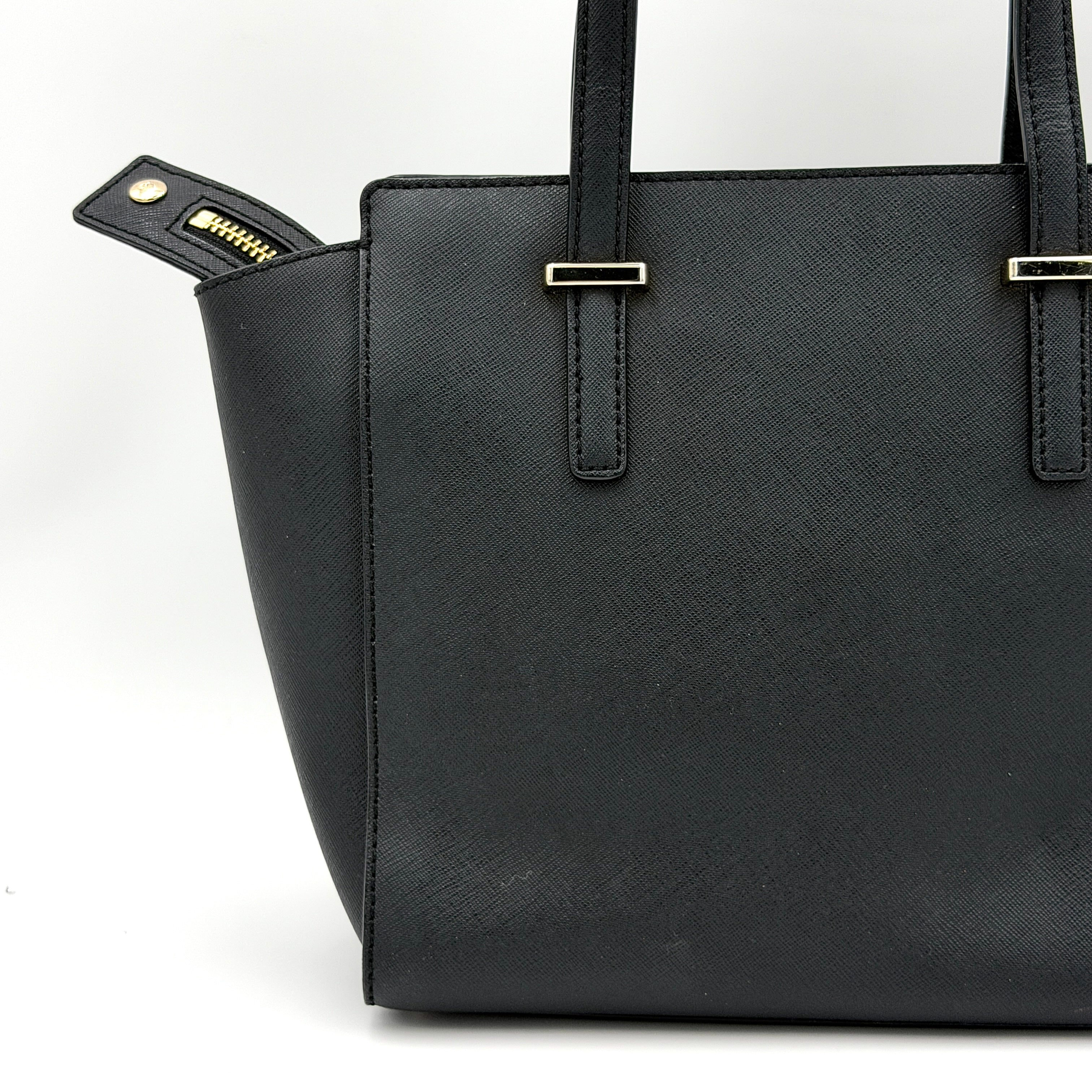 Kate Spade black Hayden handbag with structured handles and a detachable strap displayed beside it.