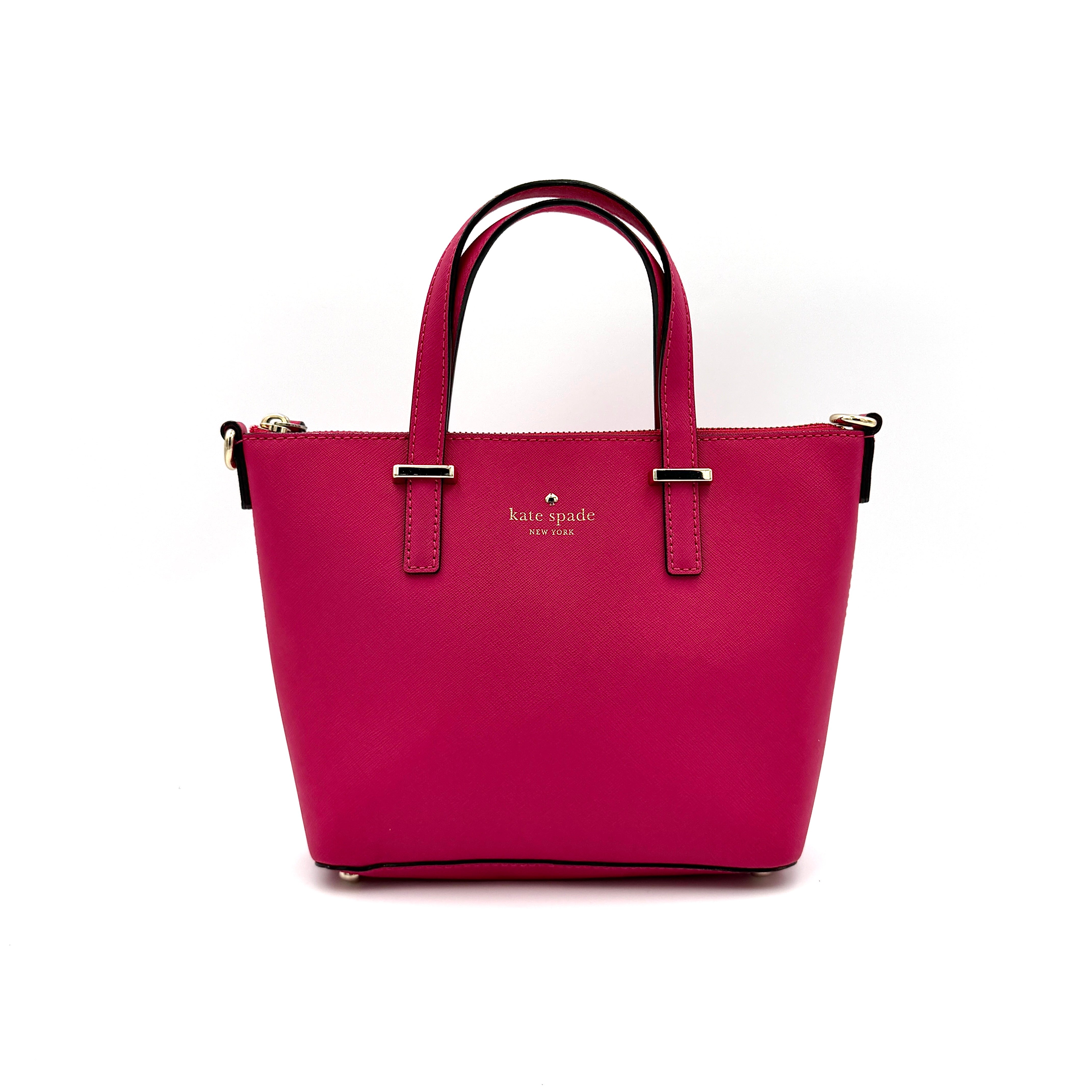 Kate Spade Cedar Street handbag in bold fuchsia pink Saffiano leather, shown with top handles and detachable strap alongside.
