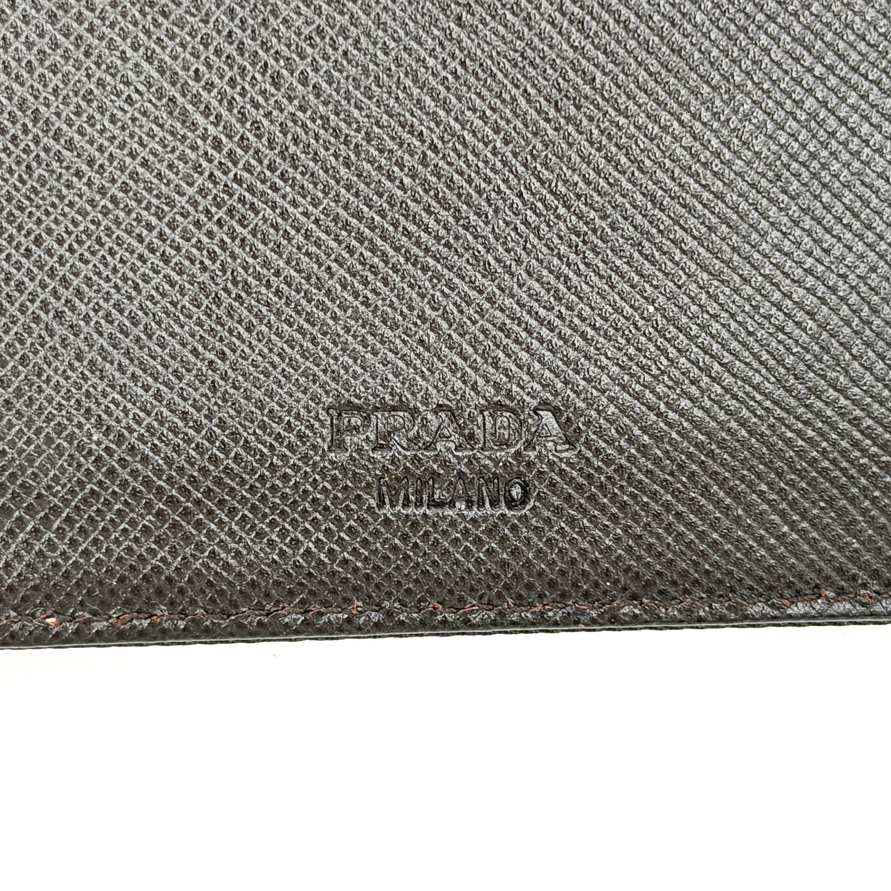 Prada Tessuto Nylon Bifold Wallet in black featuring the iconic enamel triangle logo on the front flap.