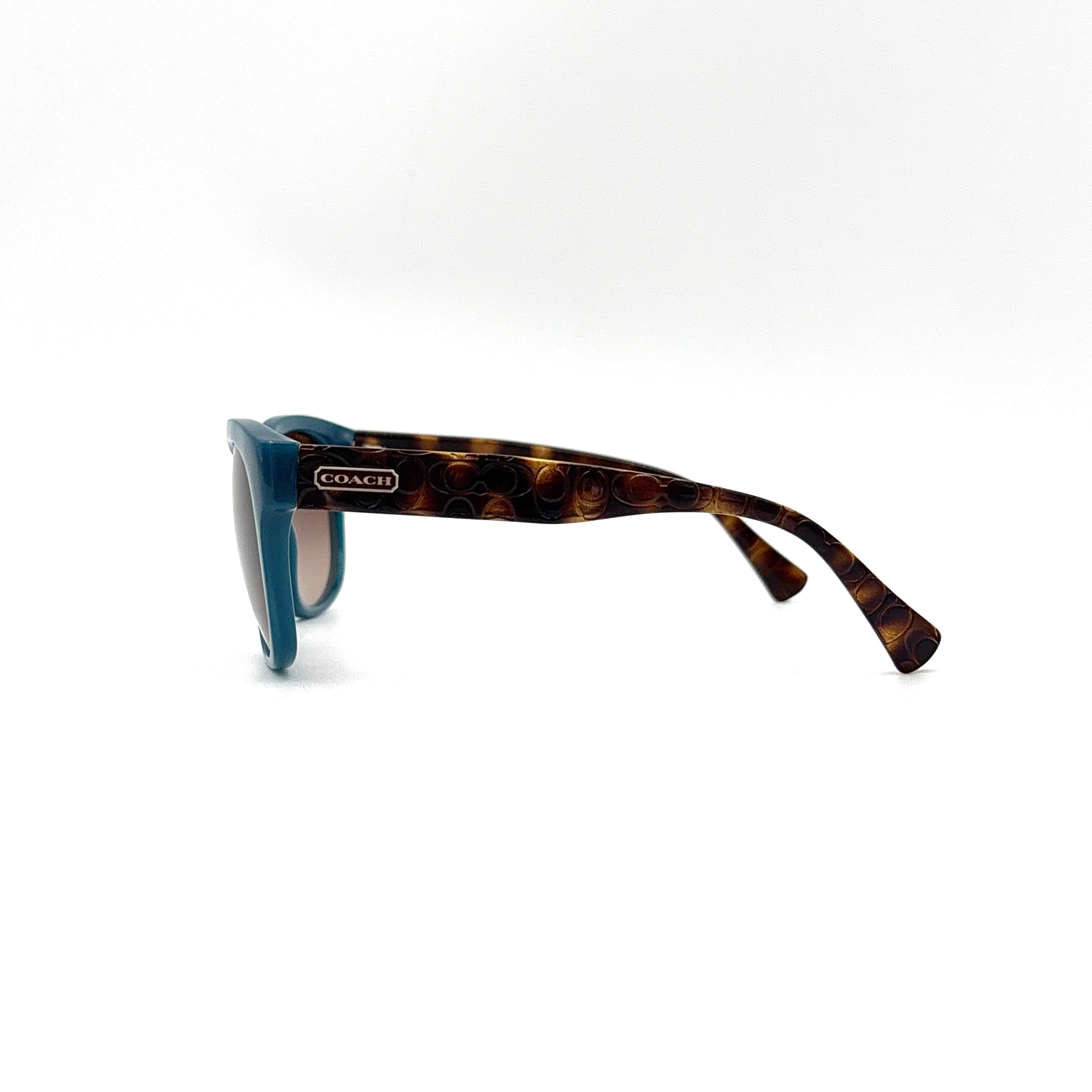 Coach HC8110 sunglasses in teal and dark tortoiseshell acetate with gradient brown lenses, shown at a three-quarter angle.