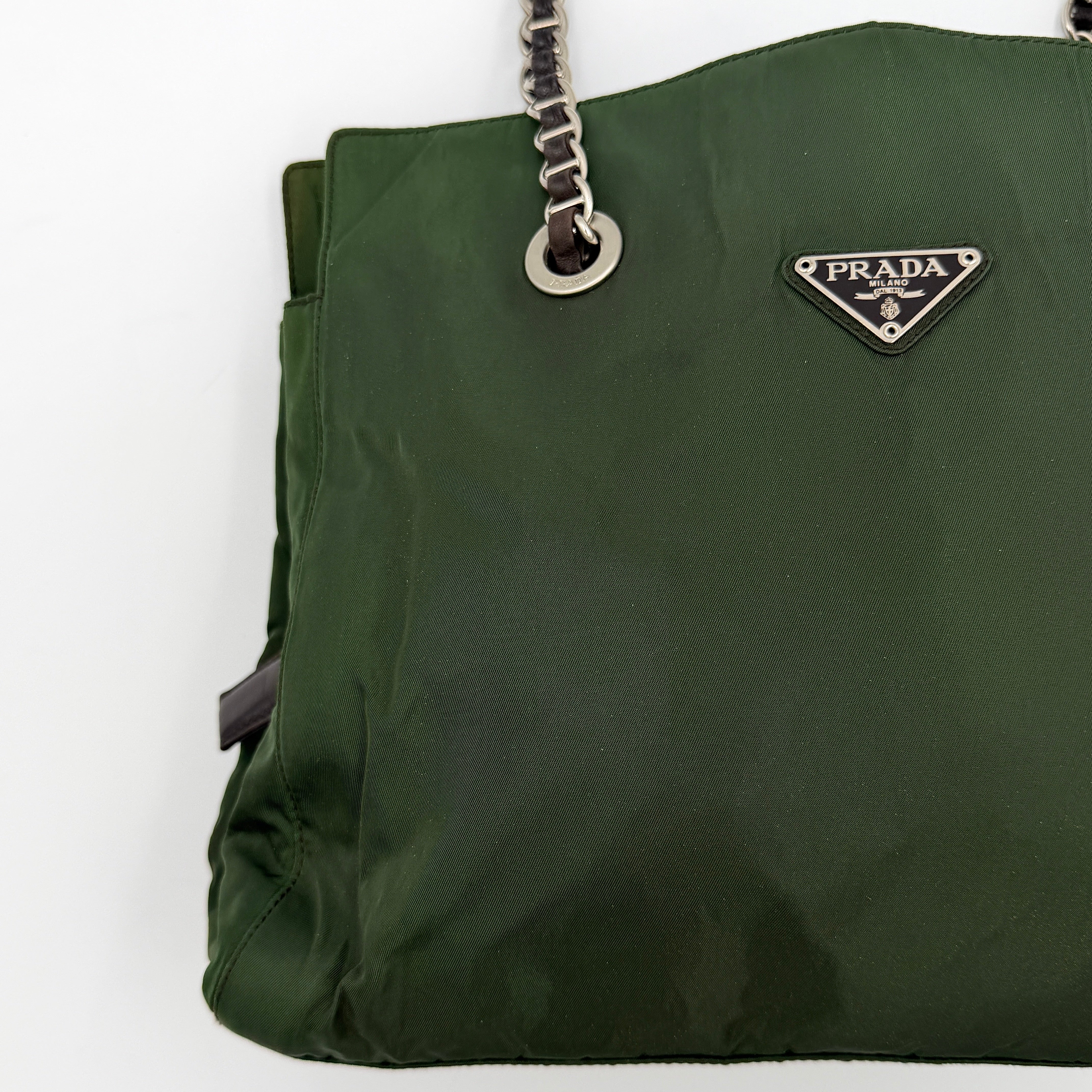 A Prada Tessuto Nylon Chain Shoulder Bag in deep green with silver-tone chain straps, featuring the iconic triangular logo on the front.