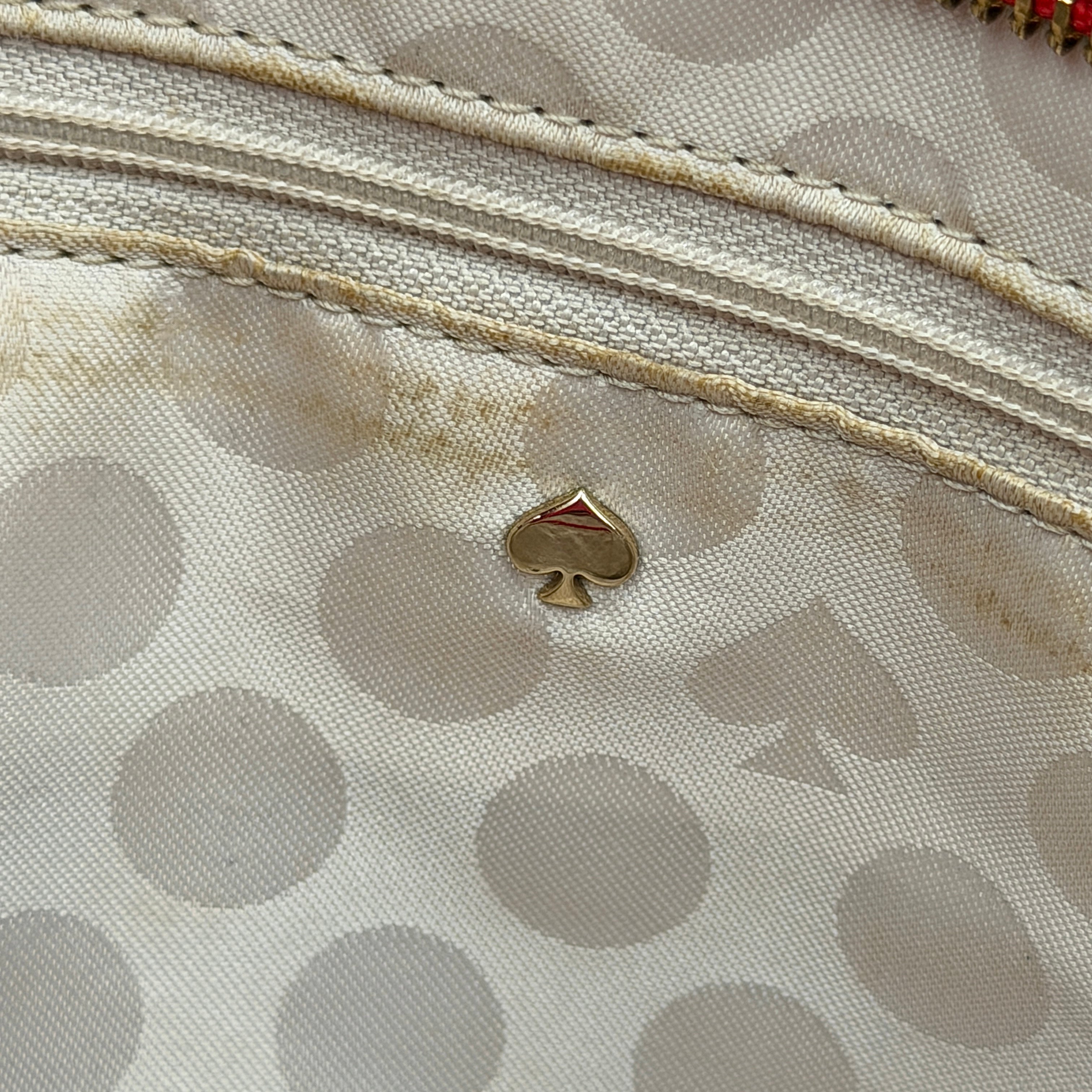 A vivid red Kate Spade Cedar Street Harmony Tote Bag with structured handles and gold-tone logo, shown against a white background.
