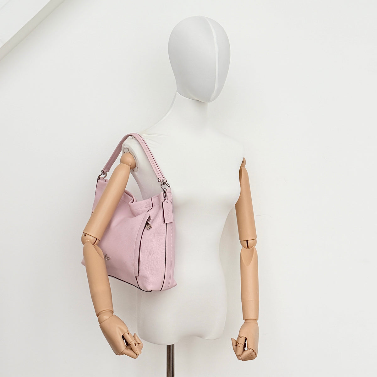 Coach 2Way Scout Hobo in pastel pink leather with silver hardware, shown with handle and detachable strap.