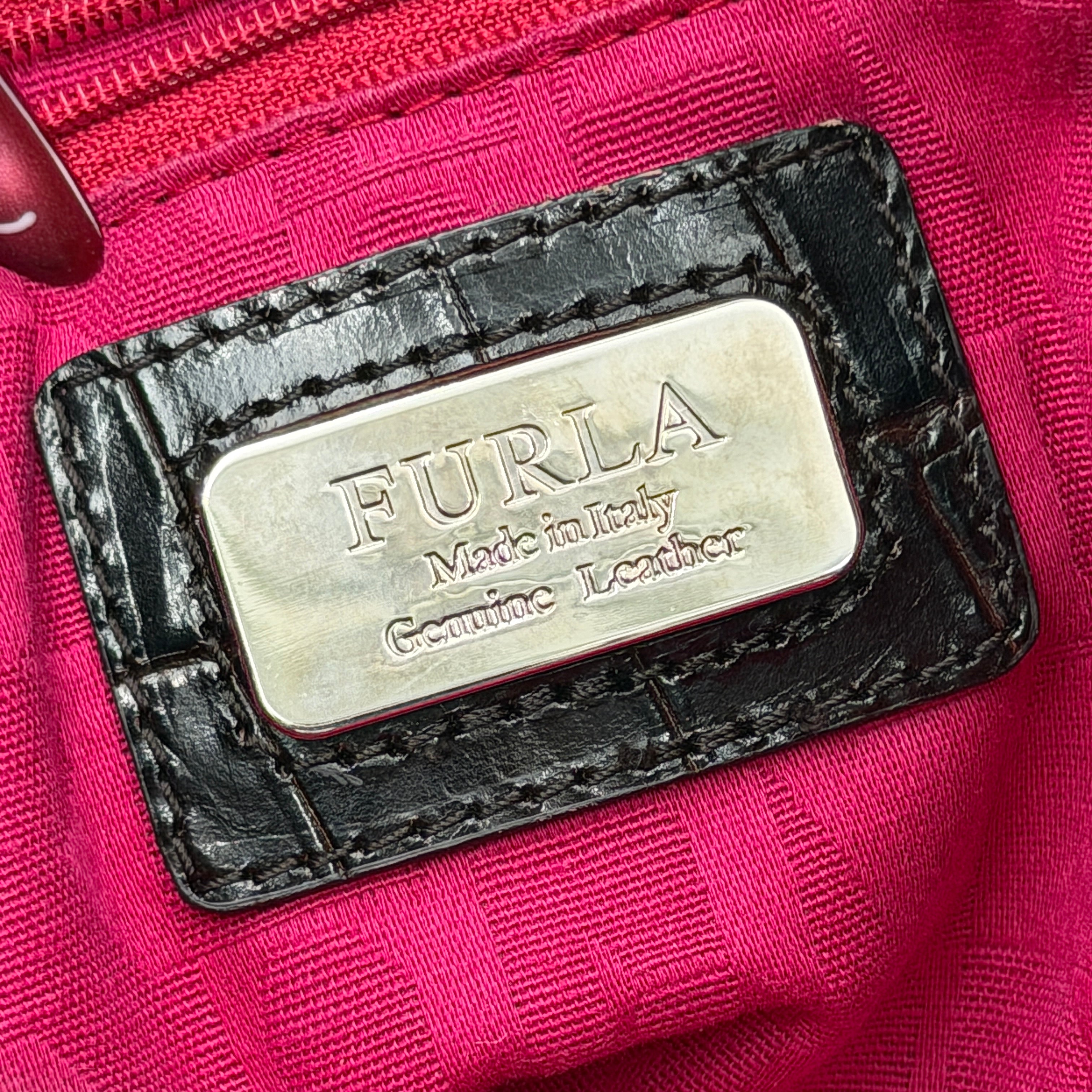 Furla croc-embossed dark brown leather handbag with structured silhouette, dual top handles, and silver turn-lock closure.