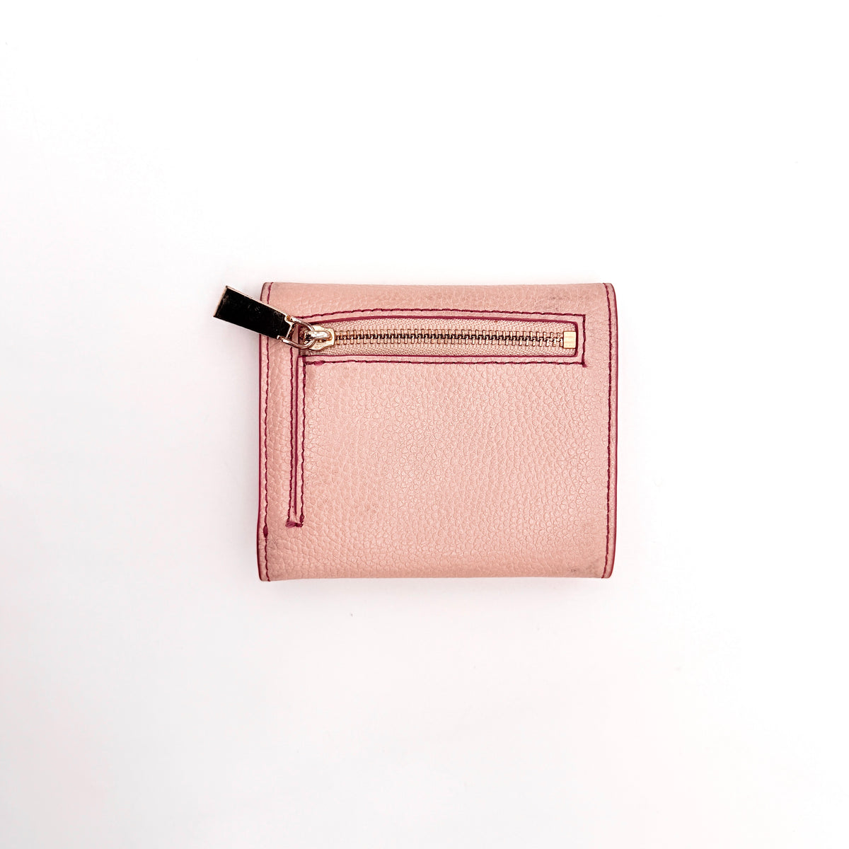 Michael Kors pink leather envelope trifold wallet with gold MK logo, shown closed on a white background.